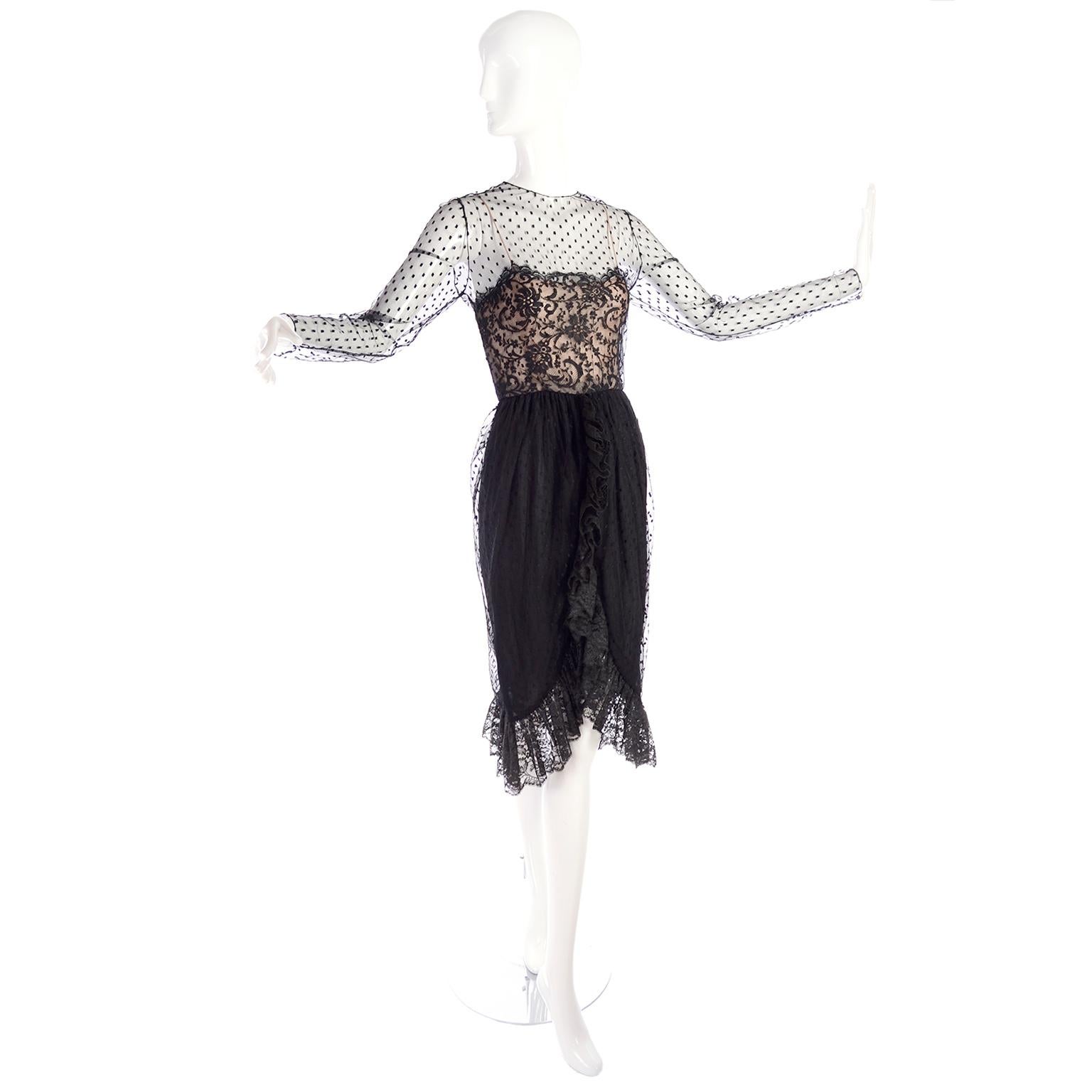 We love this dress! This 1970's Bill Blass vintage black dress is made in a dotted net with lace and nude silk at the bodice. The dress has a hemline that is similar to a tulip hem edged with a ruffle. The dress closes with a button at the neck and