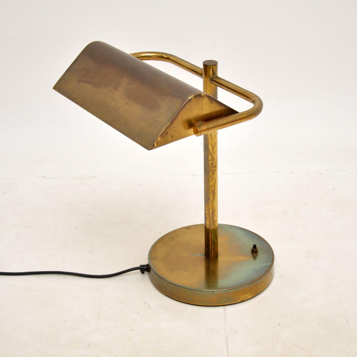 A large and impressive vintage brass bankers desk lamp. This was made in England, it dates from around the 1970s.

This is of outstanding quality, it is a great Size with a lamp shade can tilt and swivel. The brass has acquired a gorgeous colour