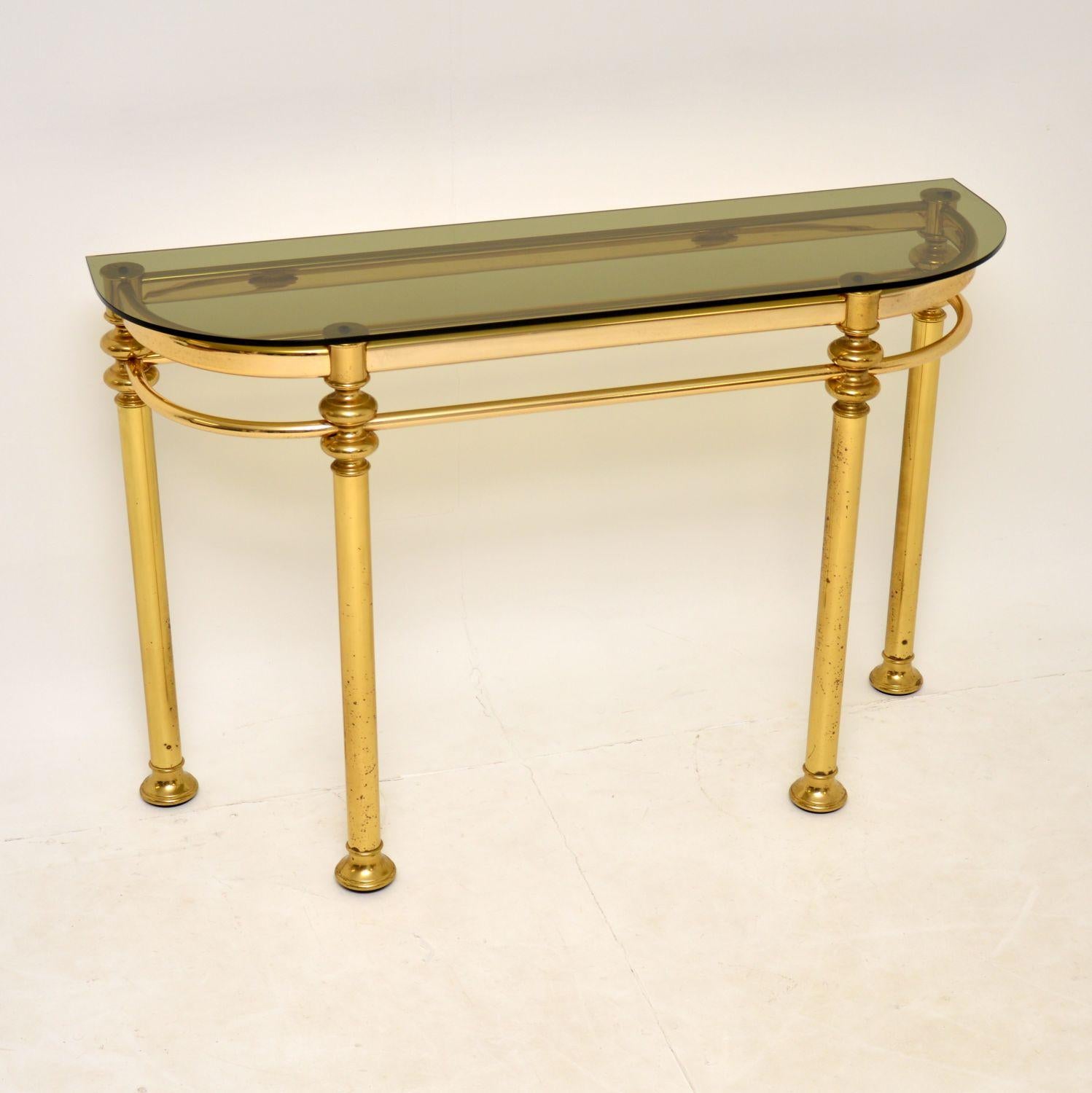 A stunning vintage console table in brass and glass. this was made in France, it dates from the 1970’s.

The quality is fantastic, this has a thick tubular brass frame and thick toughened glass top. The condition is very good for its age, with