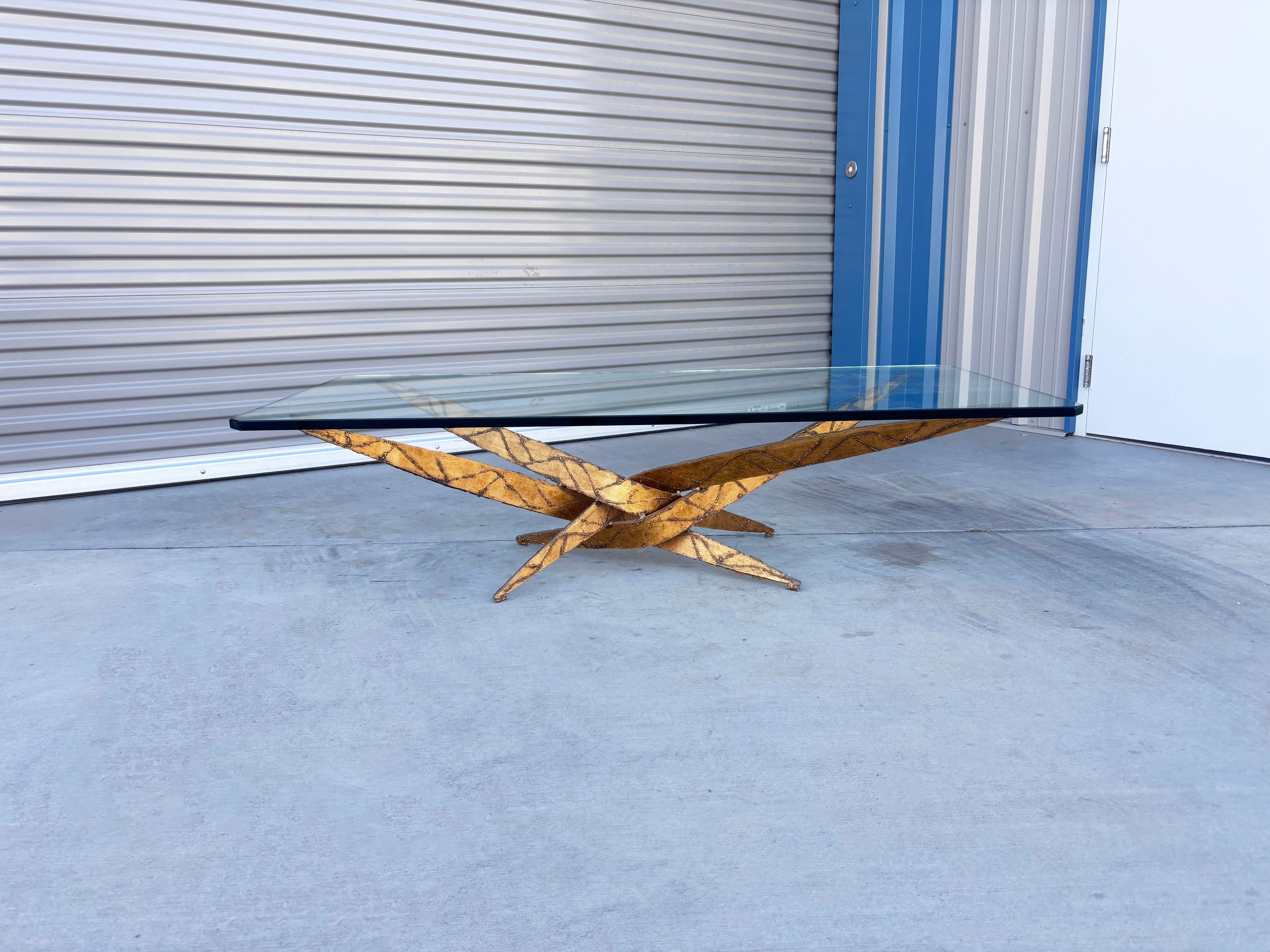 ✨ Mid-Century Brutalist Elegance by Silas Seandel ✨

This 1970s Iron and Glass Coffee Table is a captivating example of Silas Seandel’s sculptural artistry. Handcrafted with meticulous attention to detail, the table features a dynamic starburst base