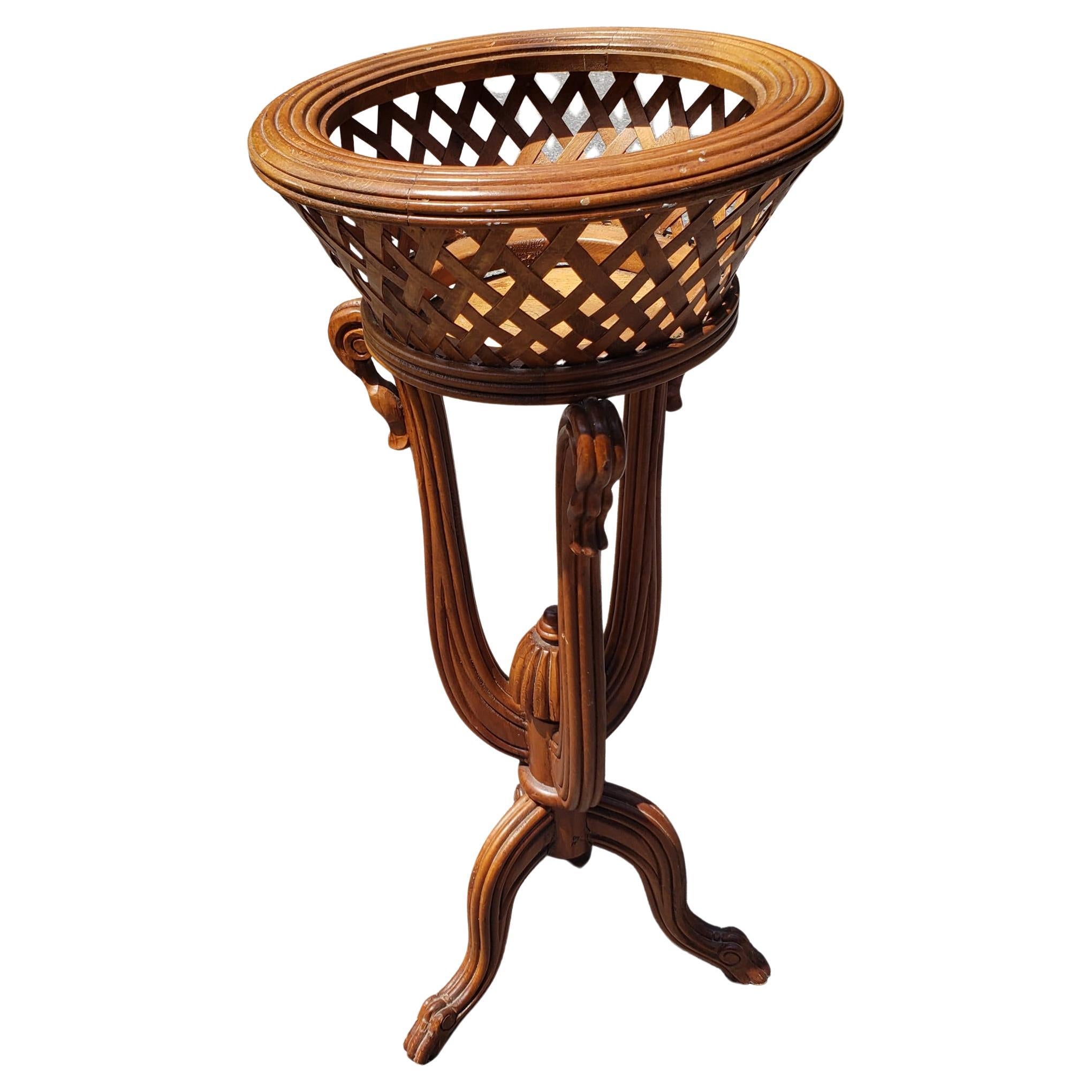1970s Vintage Fruitwood tripod planter on stand. Carved fruitwood. Hand woven wood planter. Measures 16 inches in diameter and stands 36 inches tall. Opening is 11.25 inches in diameter with 6 inches deep planter basket Good vintage condition.