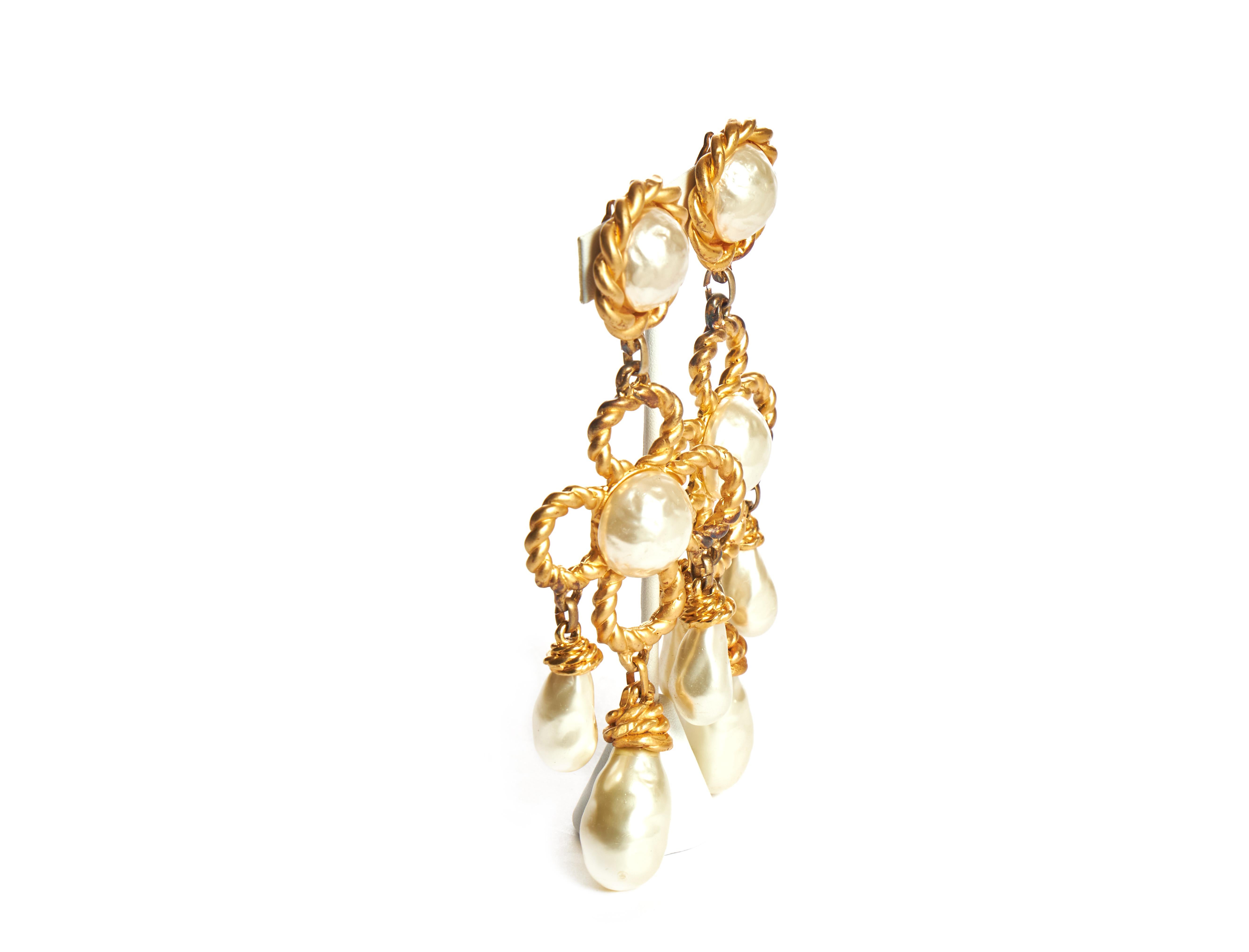 Chanel rare and collectible 70s oversized pearl drop earrings. Satin gold metal. Minor tarnish on gold. Mark S for sale back in the day. Comes with original box.