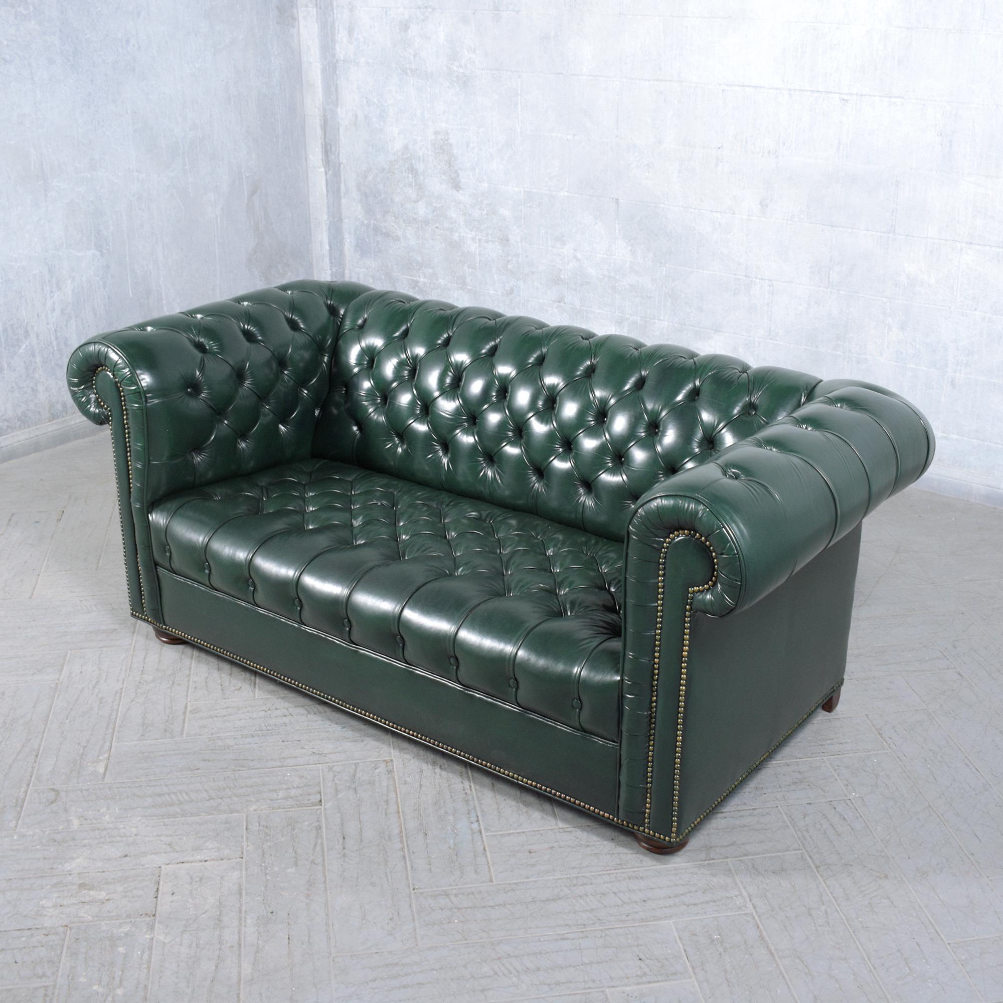 Brass 1970s Vintage Chesterfield Sofa: Emerald Green Leather with Elegant Carved Legs