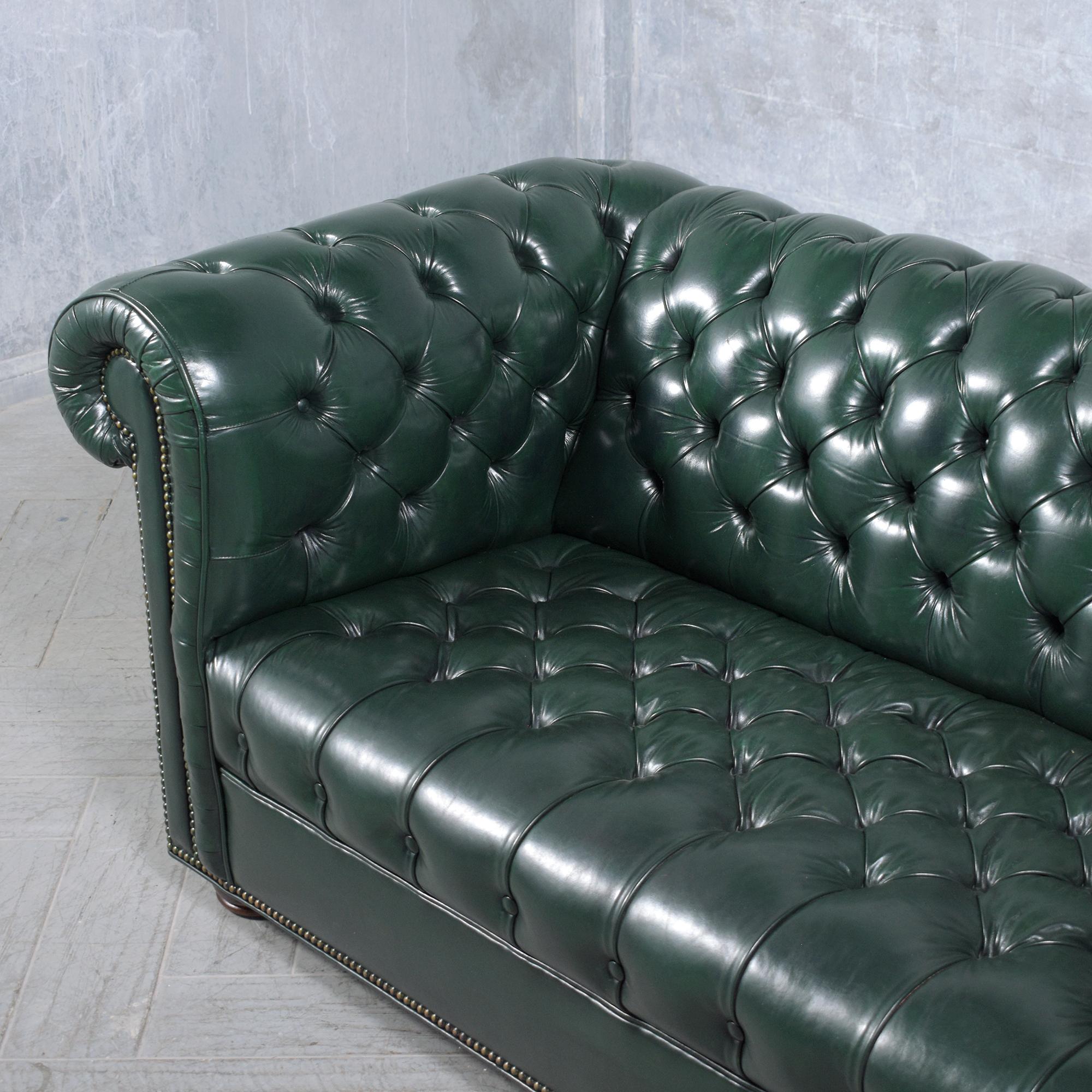 1970s Vintage Chesterfield Sofa: Emerald Green Leather with Elegant Carved Legs 1
