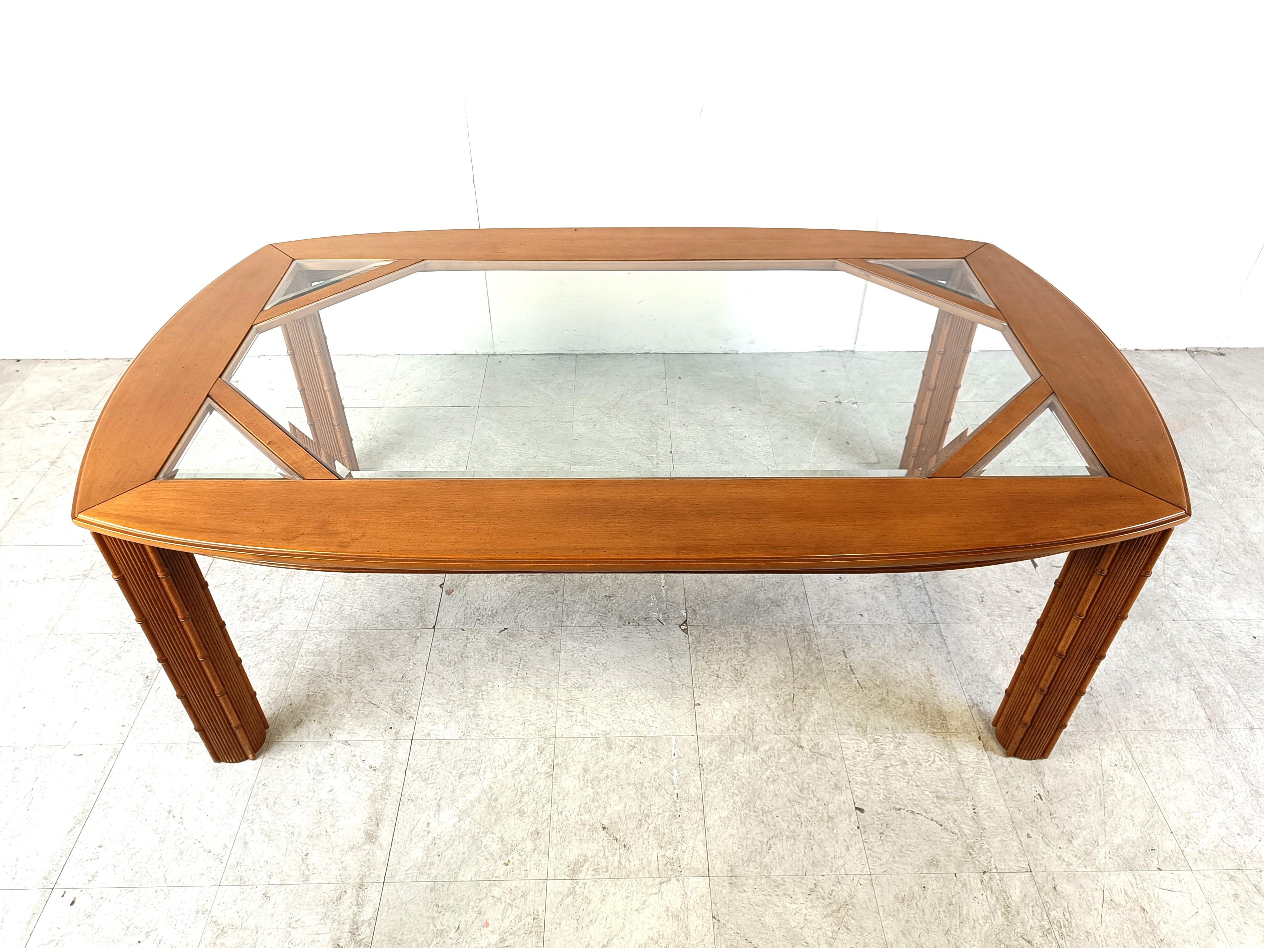 Vintage chinoiserie faux bamboo wooden dining table with 4 legs, a rounded table top with beveled inlaid glass.

Beautiful and very elegant dining table.

1970s - France

Very good condition

Dimensions:
Height: 70cm/27.55