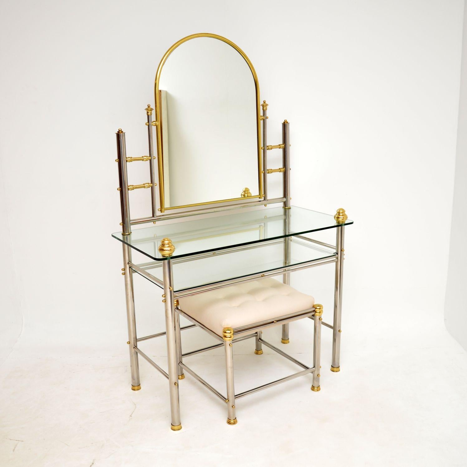 A very stylish vintage dressing table and matching stool. This was made in Italy, it dates from around the 1970s.

The quality is fantastic, this is very well made and has a great design, made from a combination of brass and chrome. It is large,