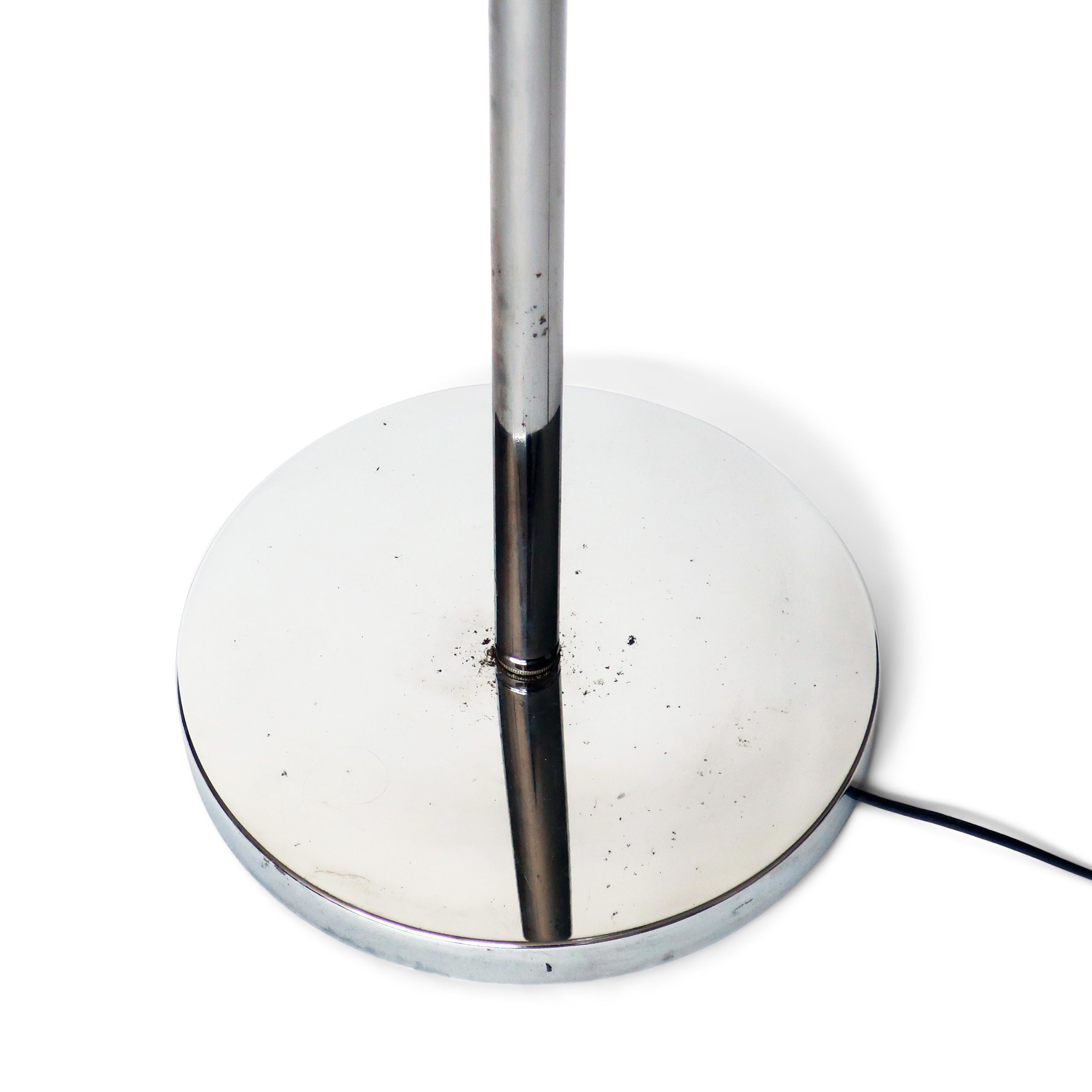 A vintage Mid-Century Modern chrome eyeball floor lamp in the style of Robert Sonneman/George Kovacs or Koch & Lowy, circa 1960s-1970s. It features three adjustable chrome globe lights on a central chrome stem and round chrome base. 

In vintage