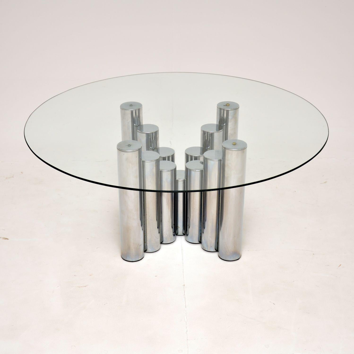A gorgeous and rare coffee table, designed by Tim Bates for Pieff of Worcester. This was made in England, it dates from the 1970’s. The base has a beautiful stepped design, made from tubular chromed steel. The circular glass top is toughened and