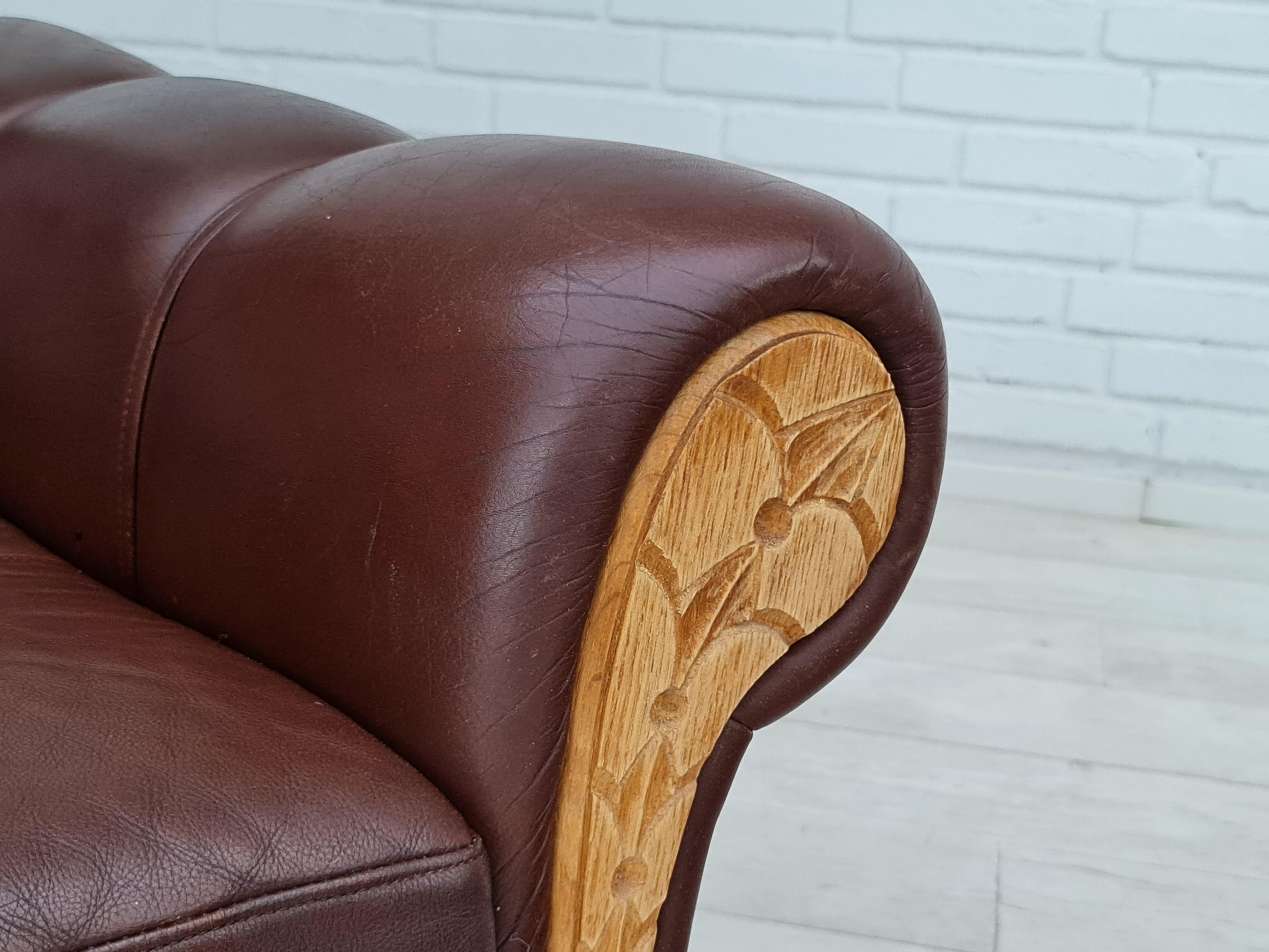 Danish desiged vintage lounge chair. Made in about 1970 by Danish furniture manufacturer. Original upholstery in good condition, no stains, no smells.  Normal signs of wear, patina. Brown leather, loose seat cushion. Oak wood leg construction. Front