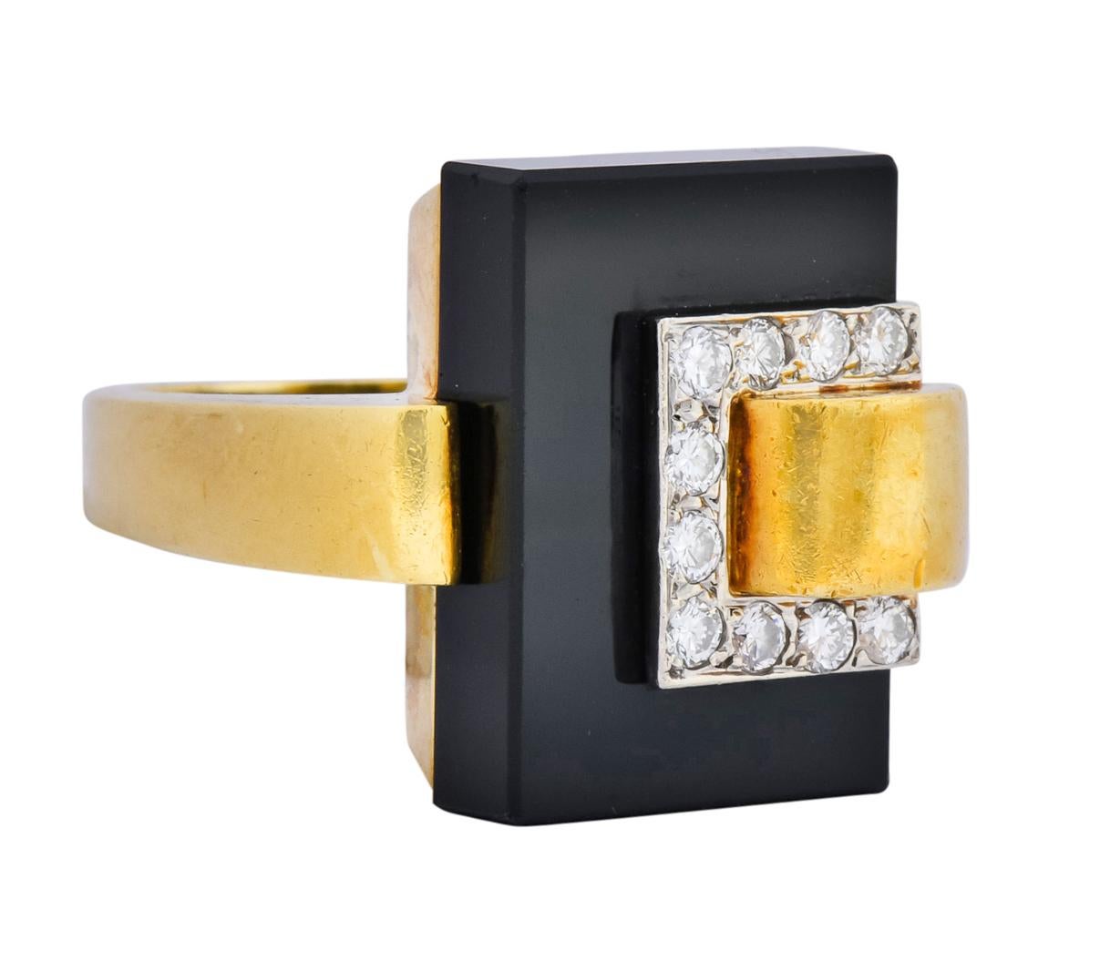 Centering a rectangular onyx tablet measuring approximately 13/16 x 9/16 inch, opaque and a glossy black

Accented by round brilliant cut diamonds, bead set in white gold, weighing approximately 0.40 carat, H/I color and VS clarity

Completed by