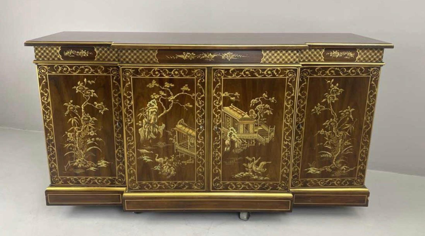 
Fabulous vintage hand painted Chinoiserie Credenza from Drexel Heritage. This is a rare one. Not often do you find the interior doors that have been hand painted as well. It’s also finished in a wood stain then lacquered. Most of these pieces in