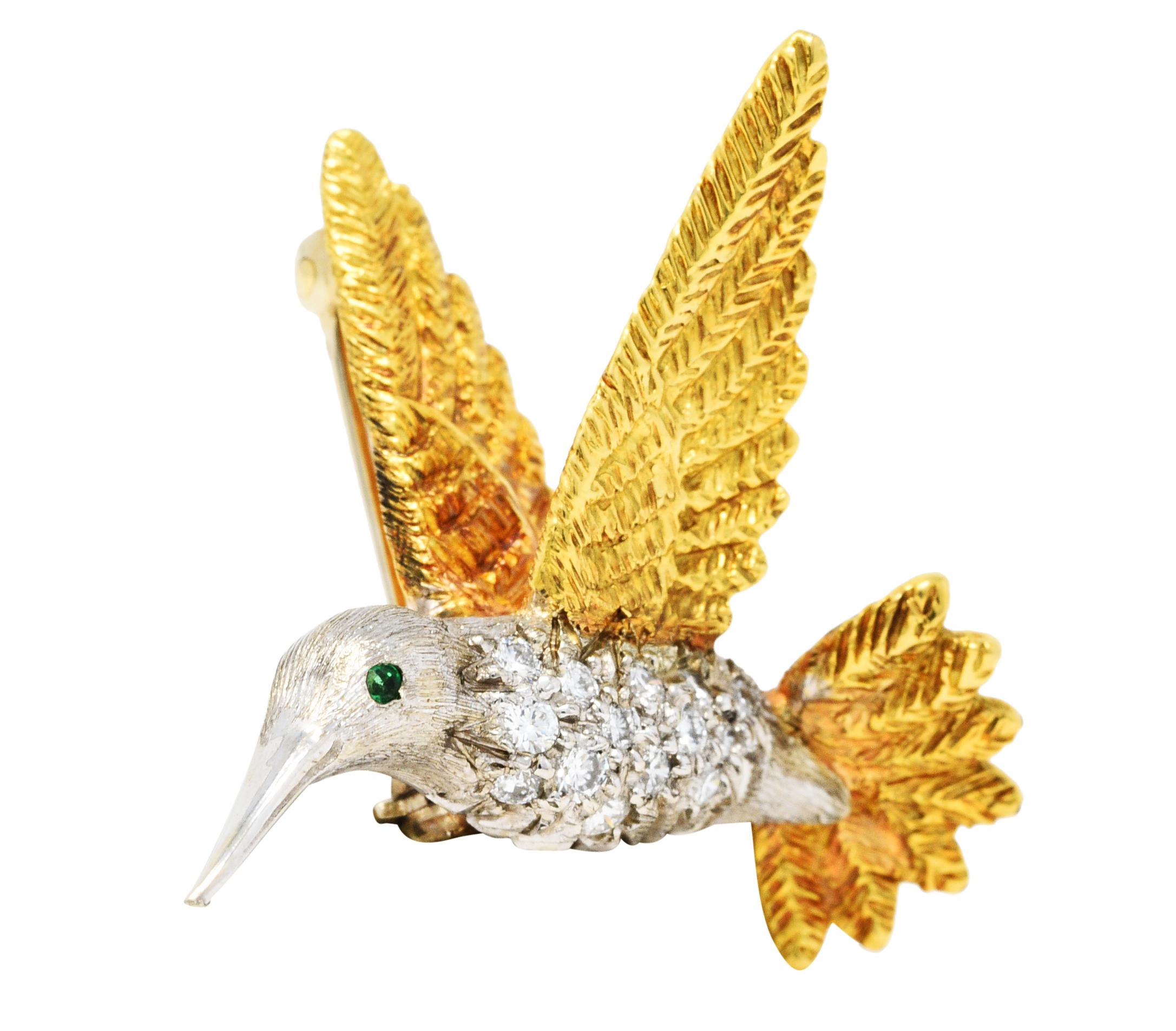 Brooch is designed as a hummingbird in mid-flight

With highly texturous yellow gold feathers and a white gold body

Pavè set with round brilliant cut diamonds weighing in total approximately 0.35 carat - eye clean and bright

With a round cut