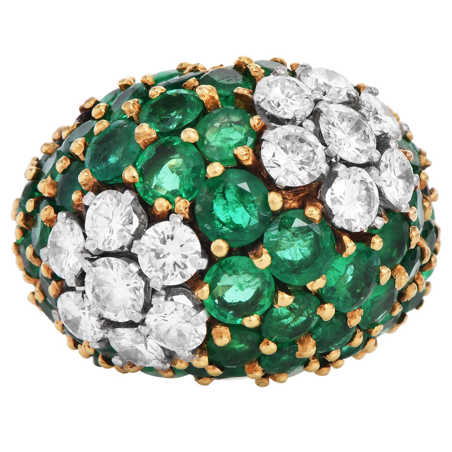 This stunning vintage Emerald and diamond cluster dome ring is crafted in 18K yellow gold. Pave set with high-quality round shape emeralds shaped tsavorites approx. 15.00 carats and round cut diamonds approx. 2.50 carats, graded H-I color, and VS