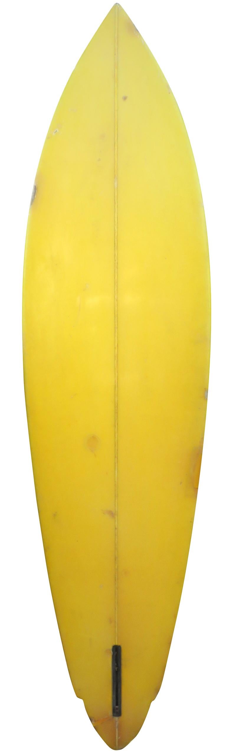 Mid-late 1970s ET surfboards winged pintail surfboard. Features an airbrush fade on deck with yellow tinted bottom and lightning bolt design on the rails. A great example of a 1970s surfboard in all original condition.
