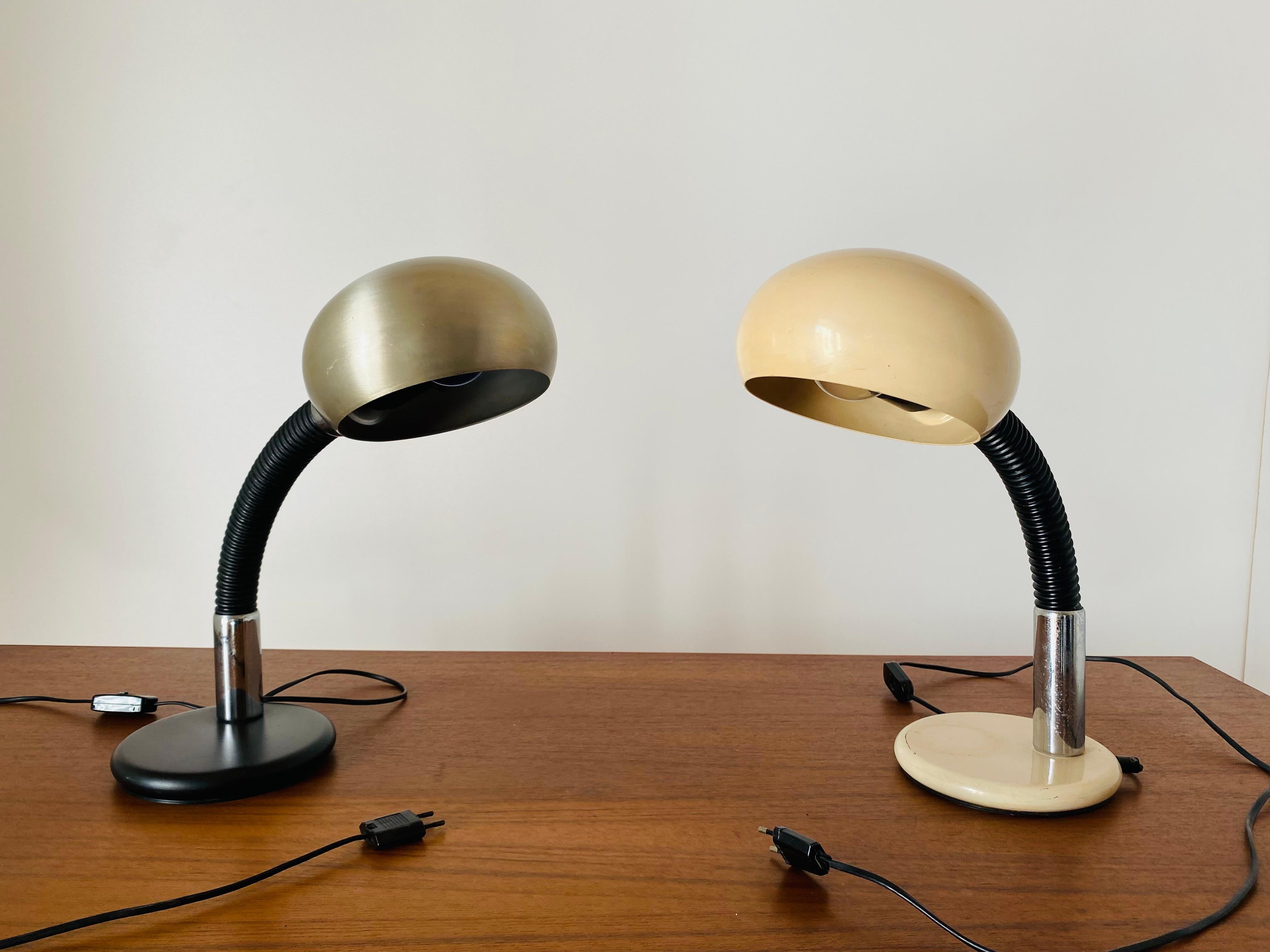 A pari of flexible table lamps manufactured in Italy in the 1970s by Gammalux. Iron structure with flexible pole. In very food conditions and perfectly working.