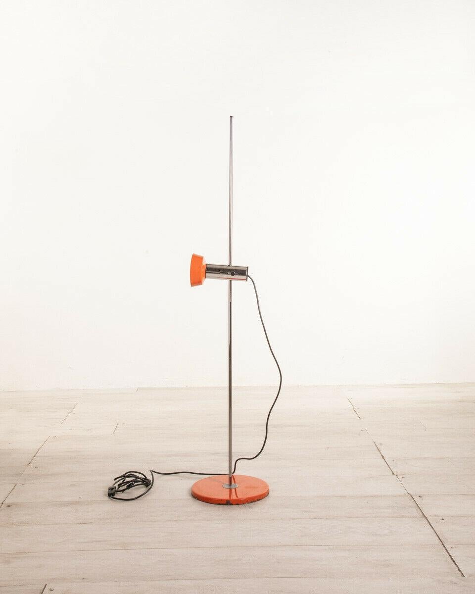 Orange metal floor lamp with chromed stem, adjustable lampshade, 1970s.

CONDITION: In good condition, working, it shows signs of wear visible in the photos.

DIMENSIONS: Height 123 cm; Diameter 26 cm

MATERIALS: Metal

YEAR OF PRODUCTION: