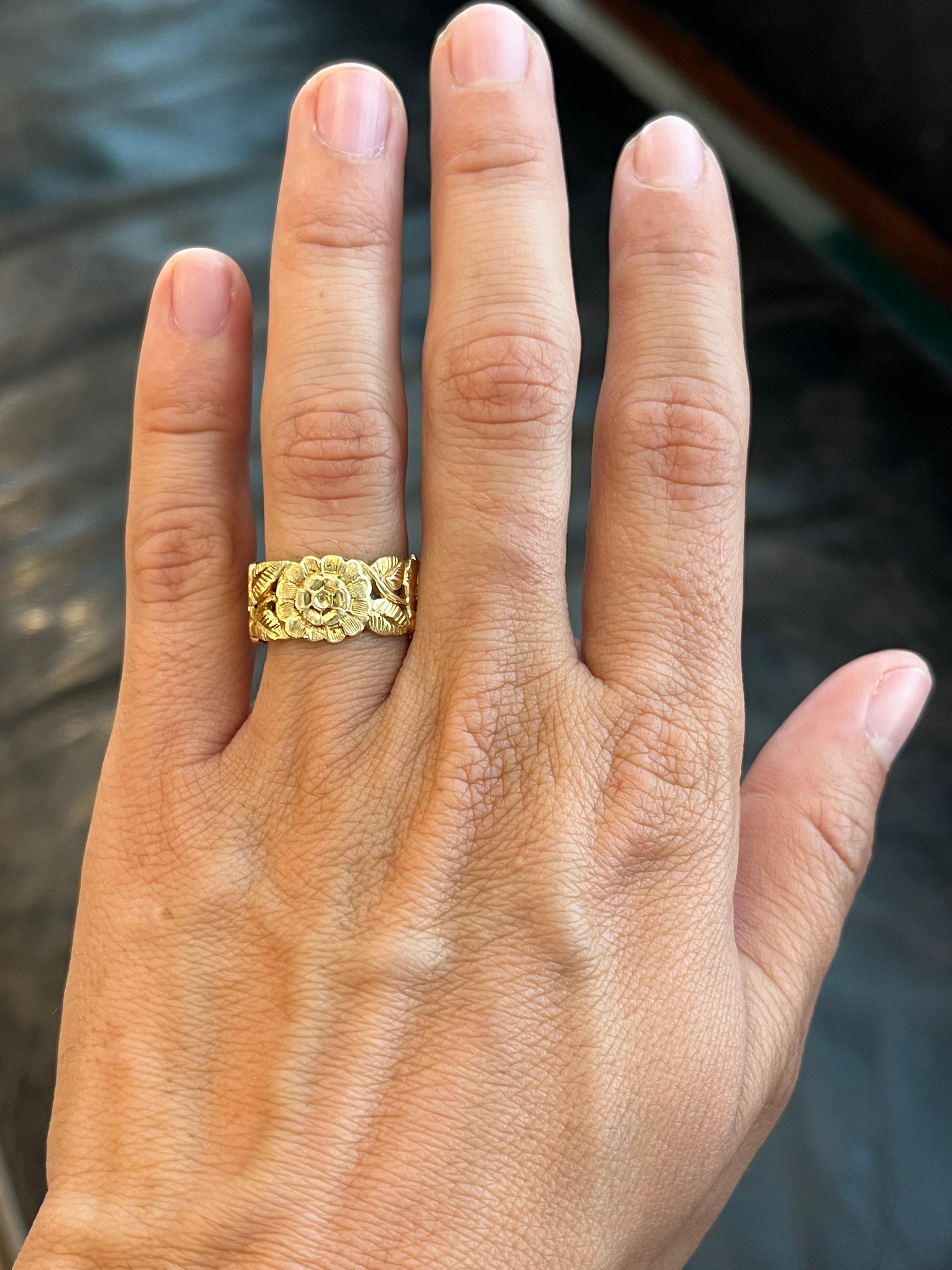 This 1970s vintage floral wedding band in 14K yellow gold is one of many unique finds from our estate wedding ring collection at Bracken Jewelers in Santa Monica, California. Deep relief sculpted floral and leaf pattern with intricate texture