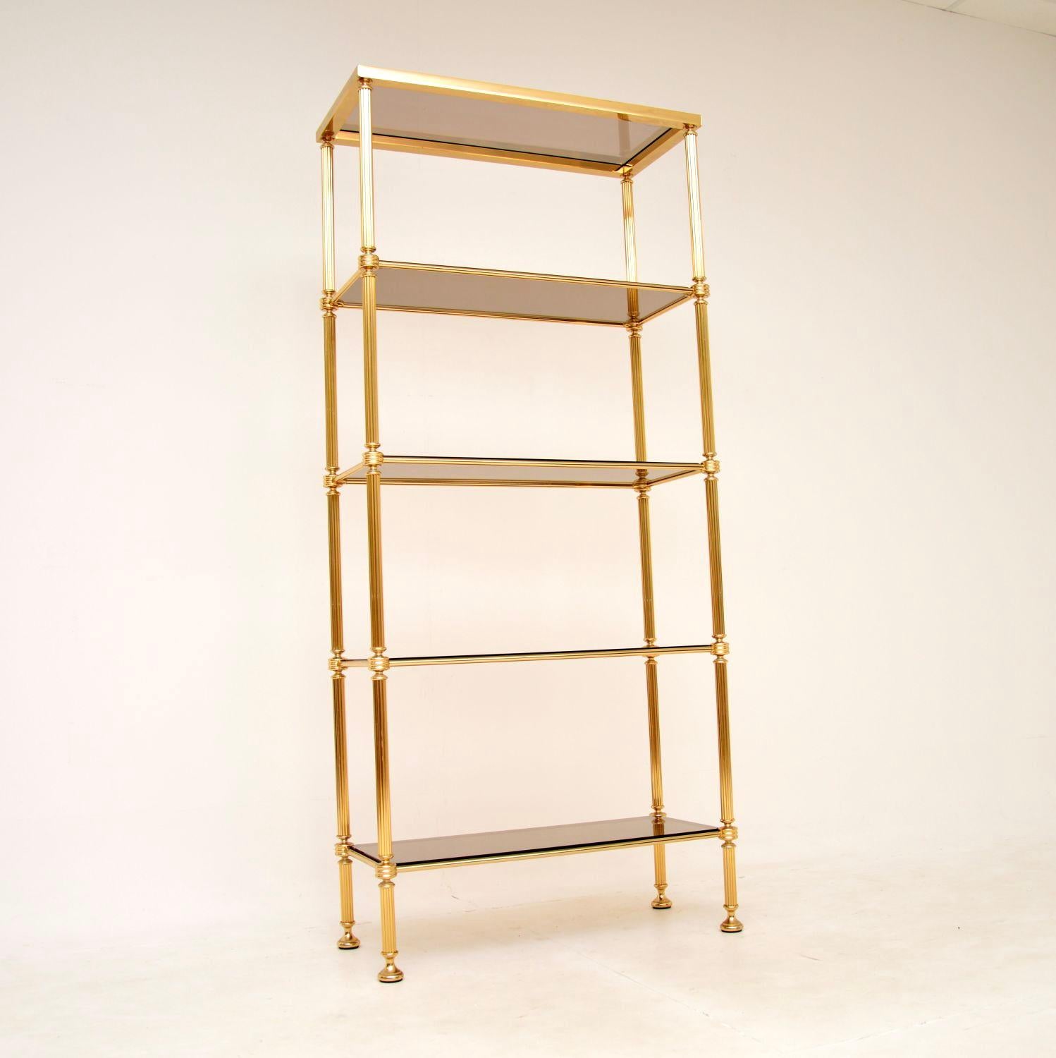 An extremely stylish and very well made vintage French etagere stand in solid brass and glass. This was made in France during the 1970’s.

The quality is outstanding, this is sturdy yet elegant, and is a fantastic size. The frame has fluted legs