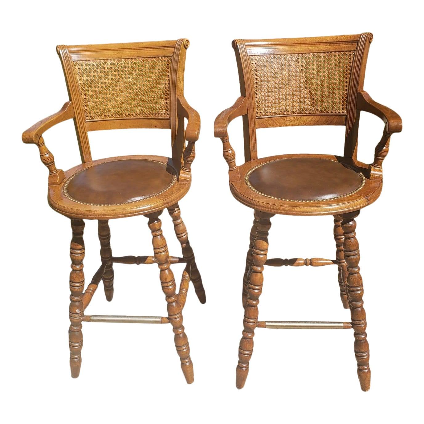 1970s Vintage Full Grain Leather and Caning Swivel Oak Bar Stools, a Pair For Sale