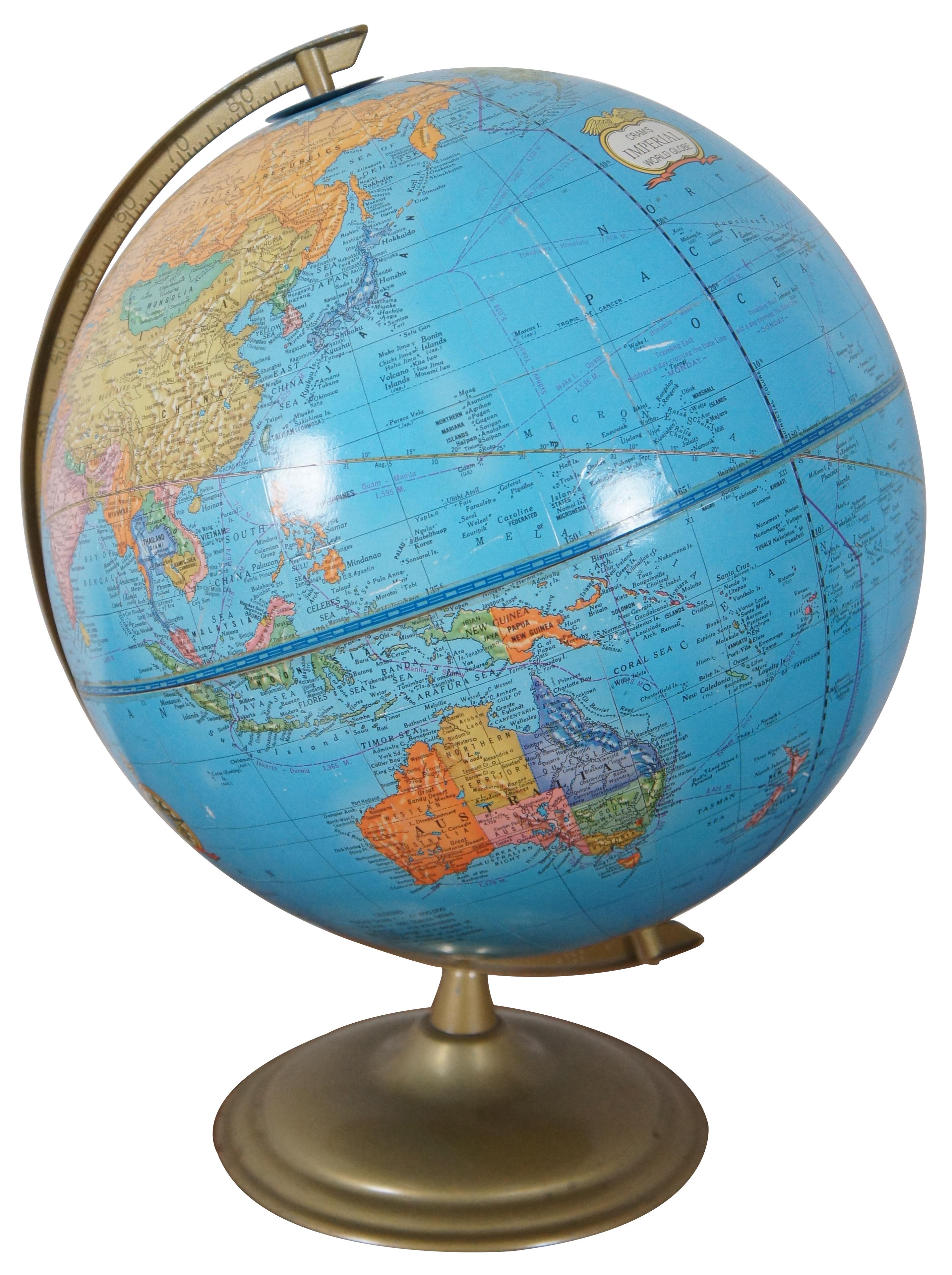 Vintage mid to late 20th century George Crams Imperial World Globe with multicolored countries, set on a brass / gold metal stand.
