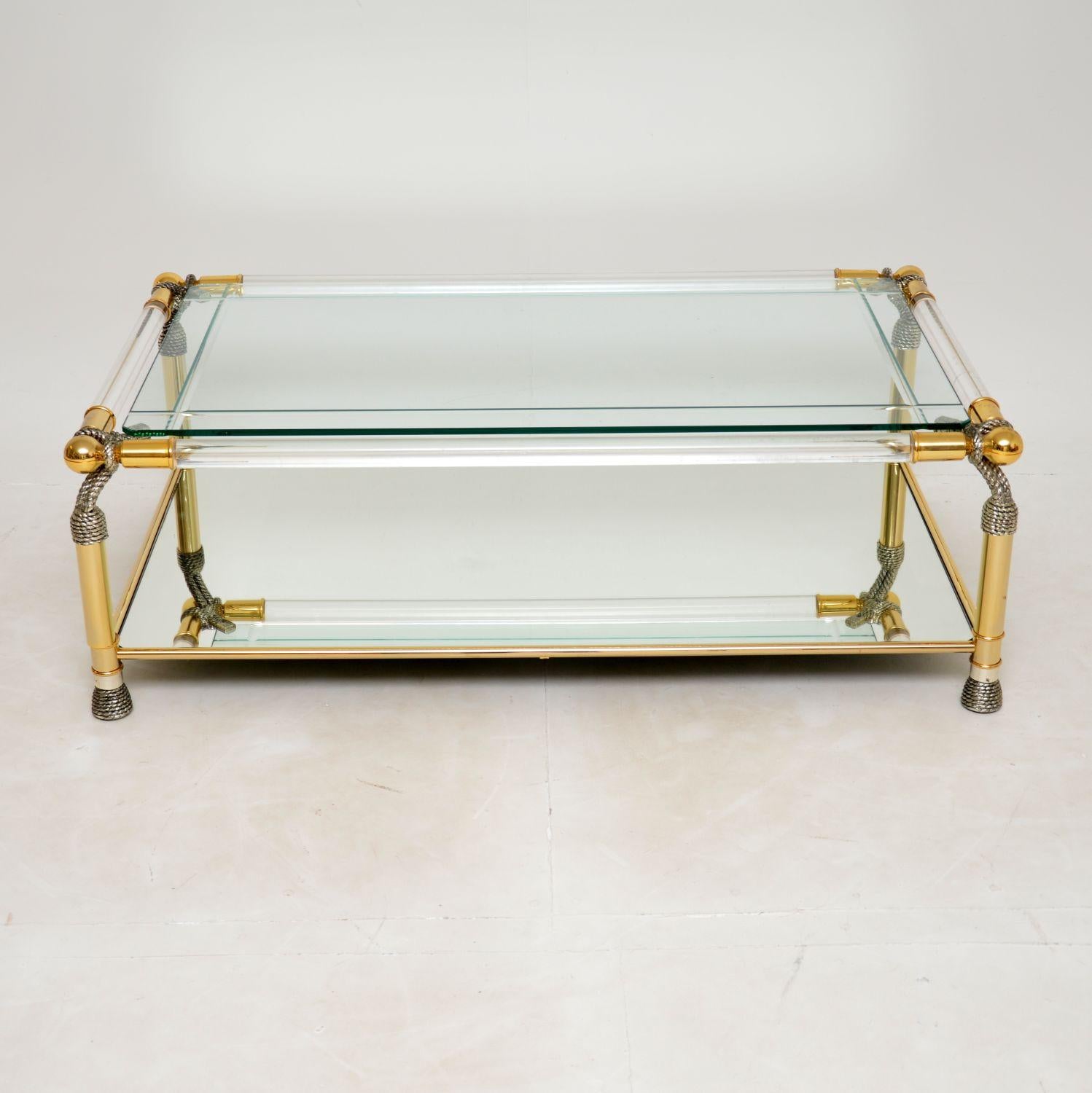 A stunning vintage decorative coffee table in clear acrylic and glass. This was made in Spain, it dates from around the 1970’s.

The quality is excellent, this is a fairly large and impressive size. The top tier is removable clear glass, the lower