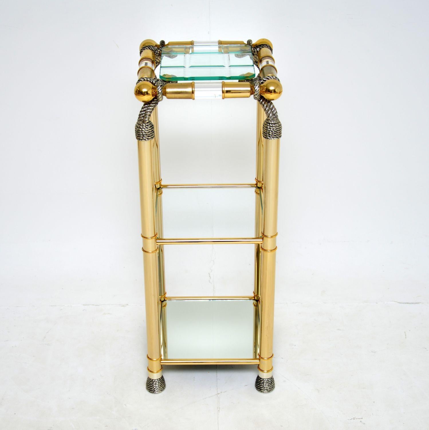 A stunning vintage decorative side table in acrylic and glass. This was made in Spain, it dates from around the 1970’s.

The quality is excellent, this is tall and slim, it is a very useful size. The top tier is removable thick clear and grooved