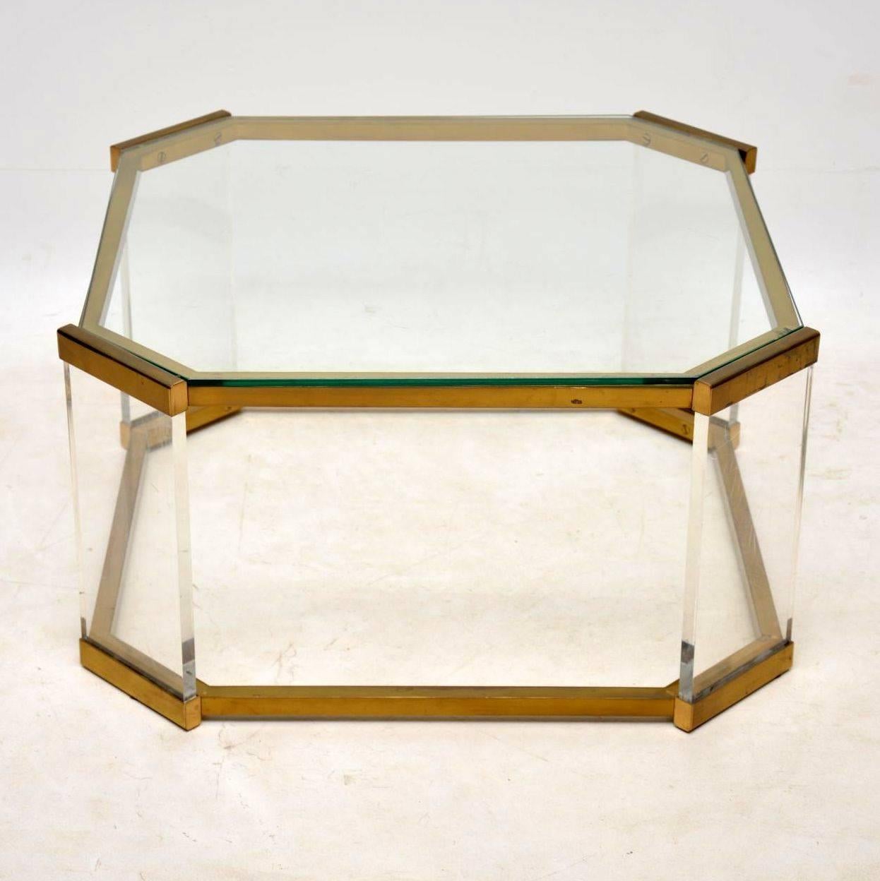 A stunning vintage coffee table made from Perspex and brass, with an inset glass top. This has a beautiful design, is very well made and is in lovely vintage condition. It’s clean, sturdy and sound, the brass has nice patina and the Perspex has only