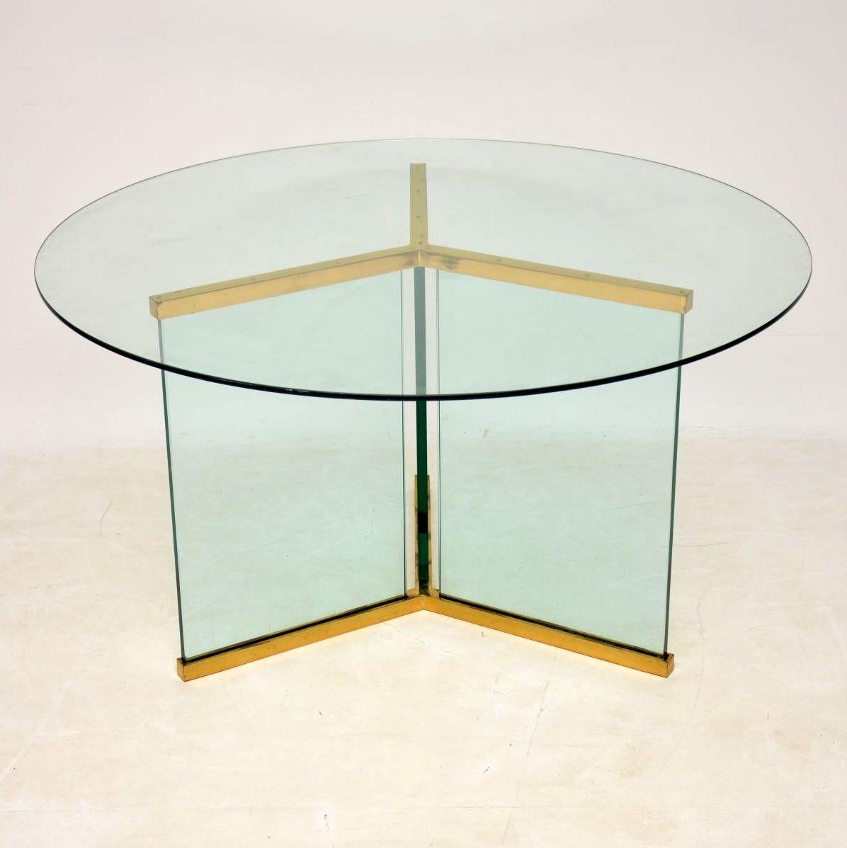 A beautiful and extremely well made vintage dining table, this was designed by Leon Rosen for Pace collection, it was made in the USA during the 1970s. It’s made entirely from glass and brass, the glass on the base is extremely thick and heavy. This