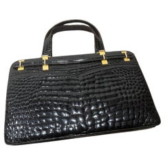 1970s Vintage Glossy Embossed Black Leather and Brass Italian Hand Bag