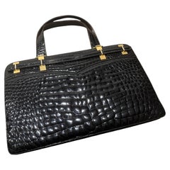 1970s Vintage Glossy Embossed Black Leather and Brass Italian Hand Bag