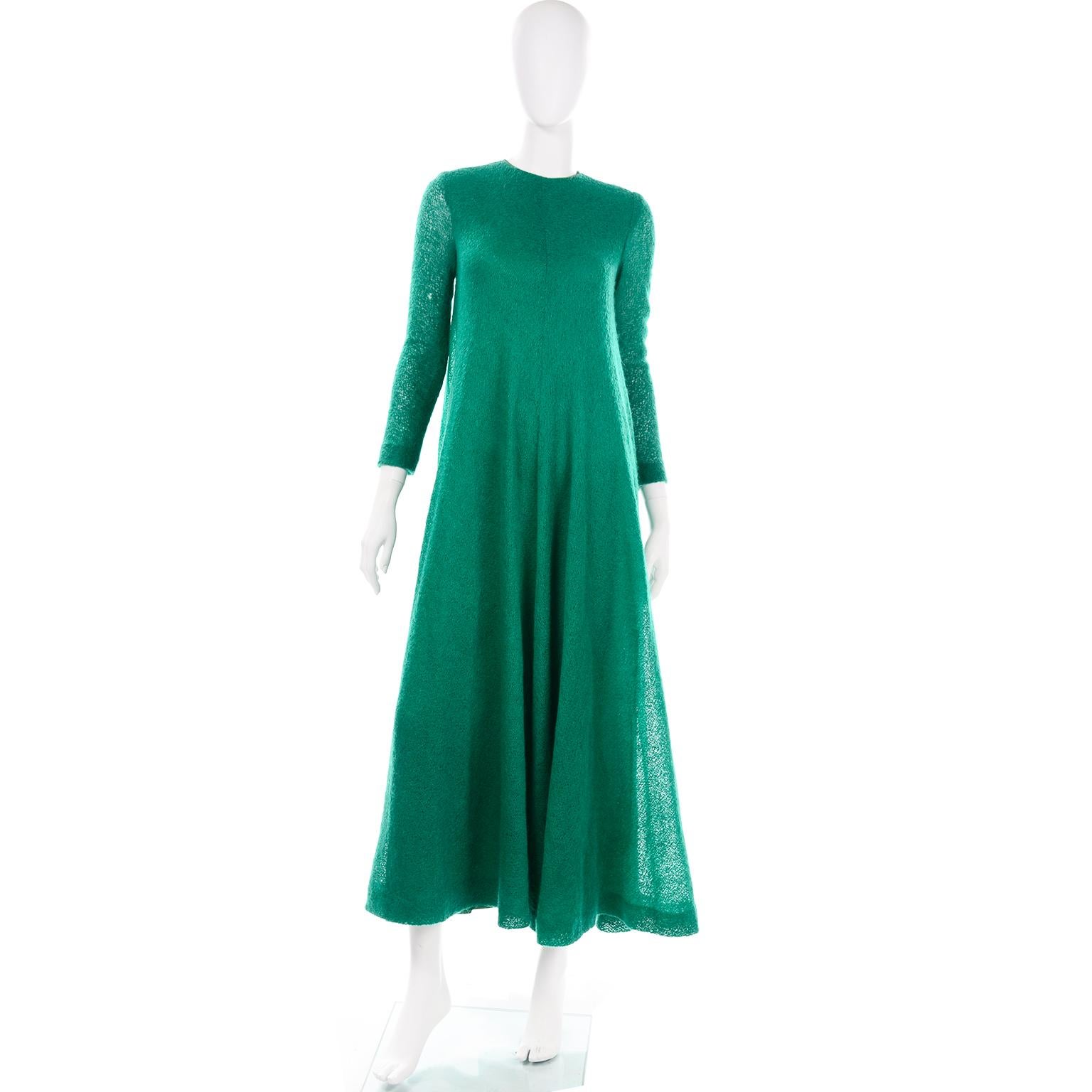 This is an incredible tent style maxi dress from the 1970's designed  by Anne Fogarty. This dress is in a very unique stunning rich shamrock green knit fabric with a rayon or nylon lining. This dress has long sleeves that are slightly sheer with a