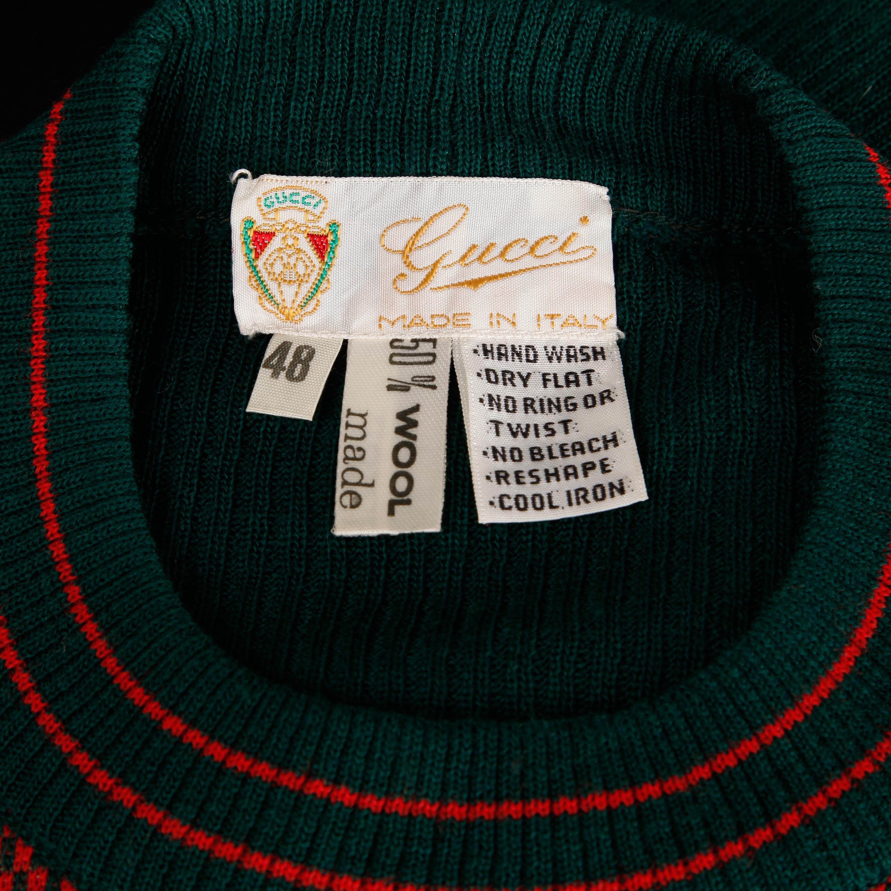 Rare 1970s vintage Gucci golf sweater in green and red from the estate of Pamela Lewis (Jerry Lewis/ Gary Lewis). Novelty design featuring checkers and golfers. Unlined with no closure (pulls on over the head). Fabric content is 50% wool 50%