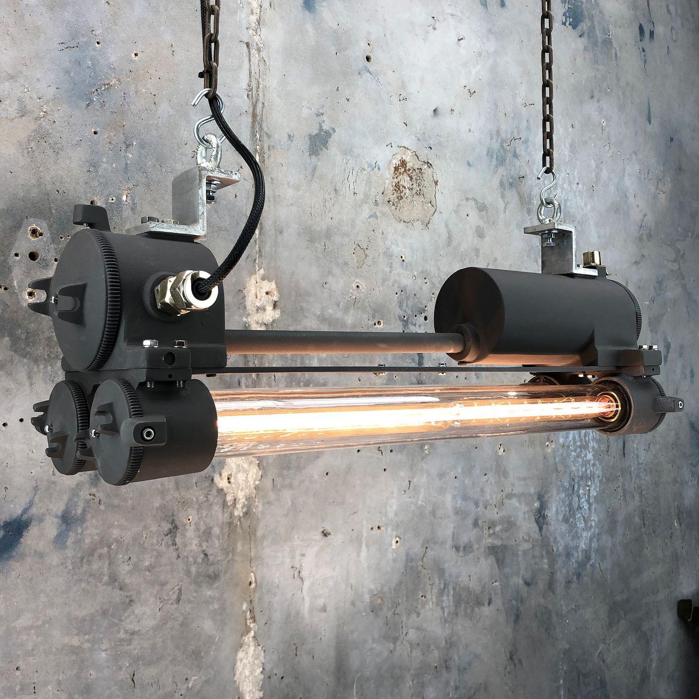 A vintage industrial 1970s black flameproof Edison twin striplight made c1977 by Daeyang, a South Korean manufacturer of industrial grade fixtures and fittings. 

Salvaged from military vessels then professionally restored by Loomlight in the UK