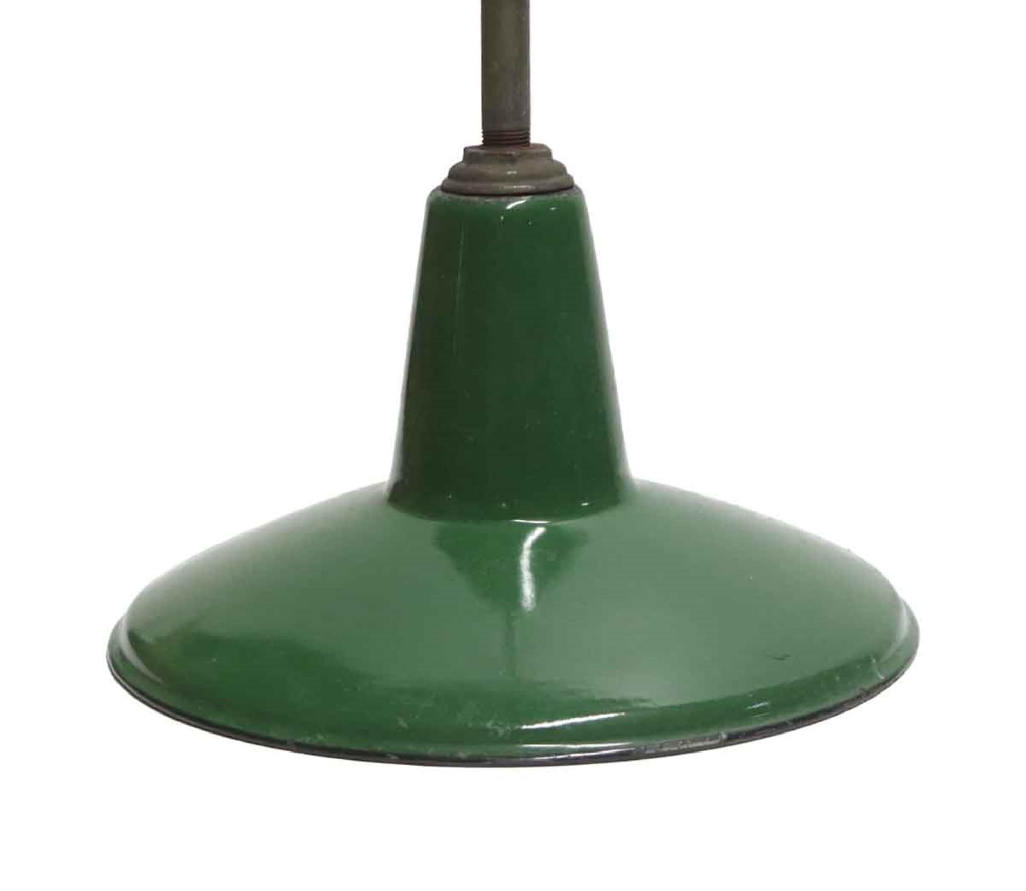 1970s green and white enameled steel Industrial pendant light. Price includes cleaning and rewiring. Small quantity available at time of posting. Please inquire. Priced each. This can be seen at our 400 Gilligan St location in Scranton, PA.