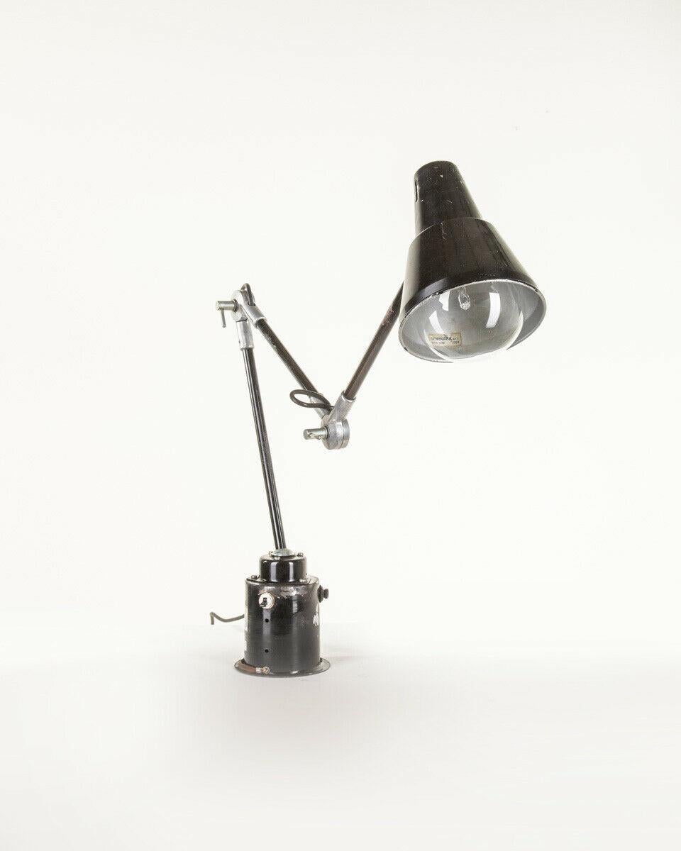 Three-armed black metal industrial table lamp with adjustable lampshade. Seminara design, 1970s.

CONDITIONS: In fair condition, working, shows signs of wear visible in the photos.

DIMENSIONS: Height 132 cm; Width 12 cm; Length 21