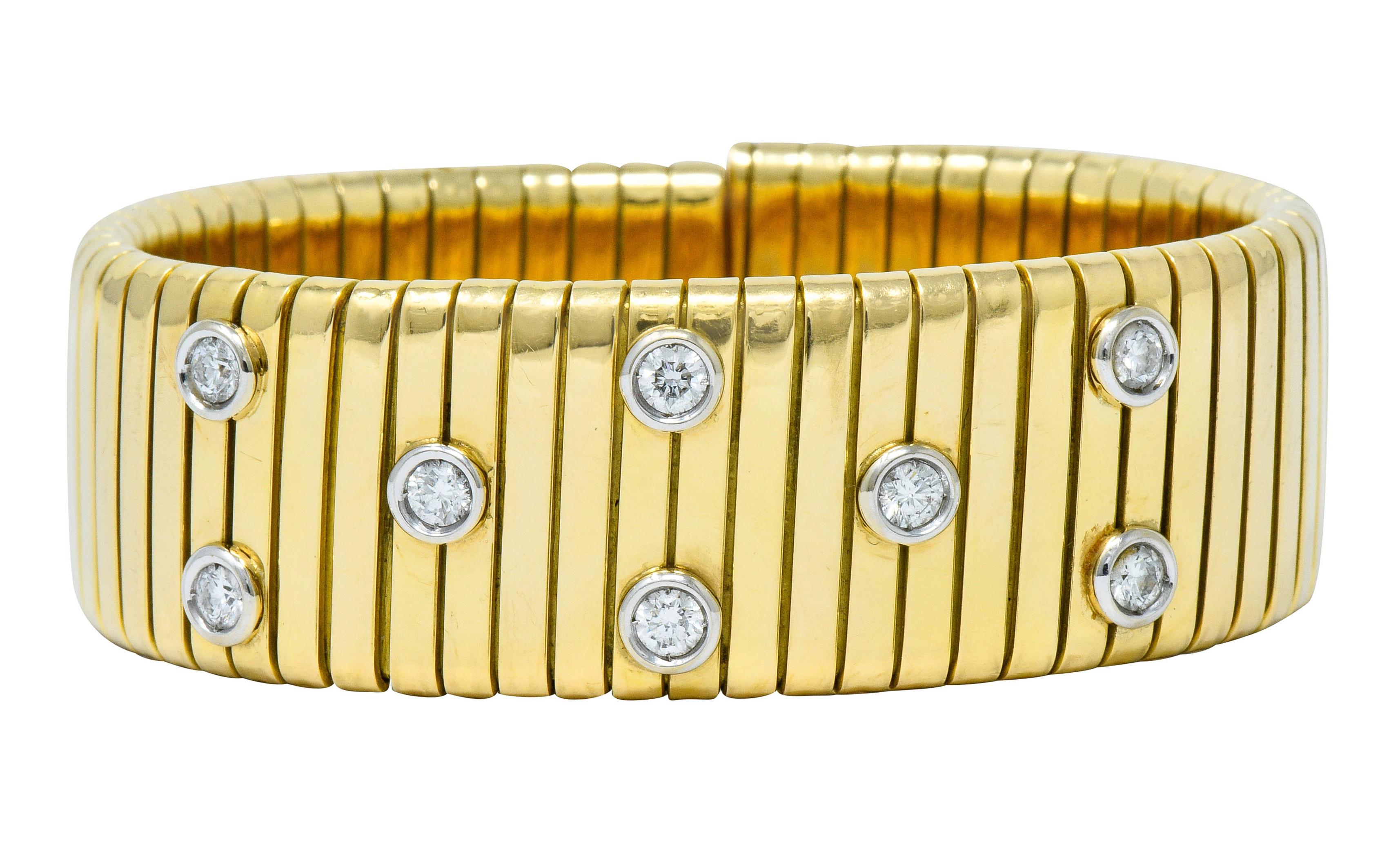 Wide cuff style bracelet comprised of flexible tubogas technology

Deeply ridged and featuring eight round brilliant cut diamonds, bezel set in 
platinum

Weighing approximately 1.45 carats with H/I color and VS clarity

With Italian assay marks for
