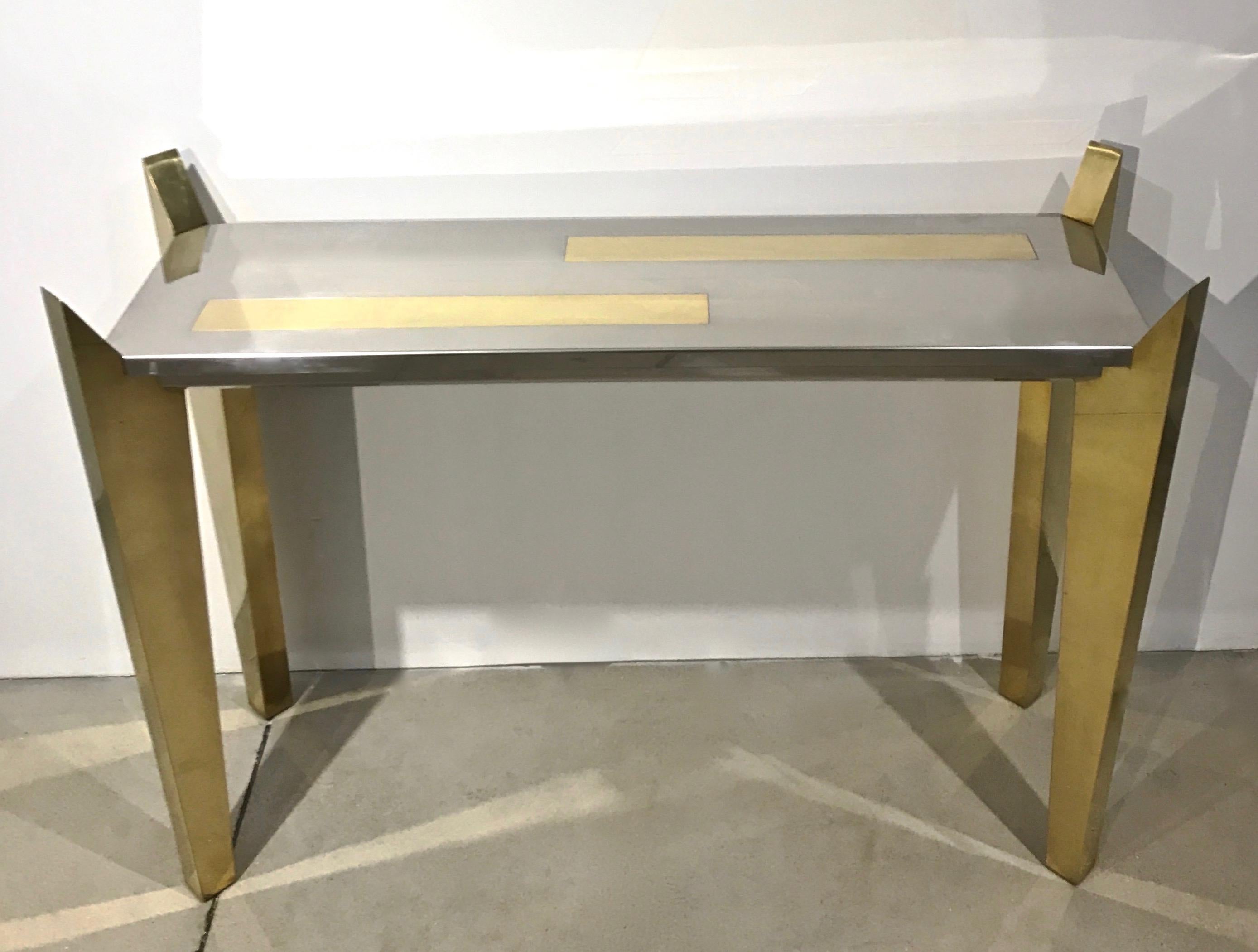 One of a kind 1970s Italian console by L'Angolo Metallarte, Rome, a rare find entirely handmade with wooden structure, unique and innovative sophisticated design: the four legs are hand covered in brass and come up in a slanted shape to embrace the