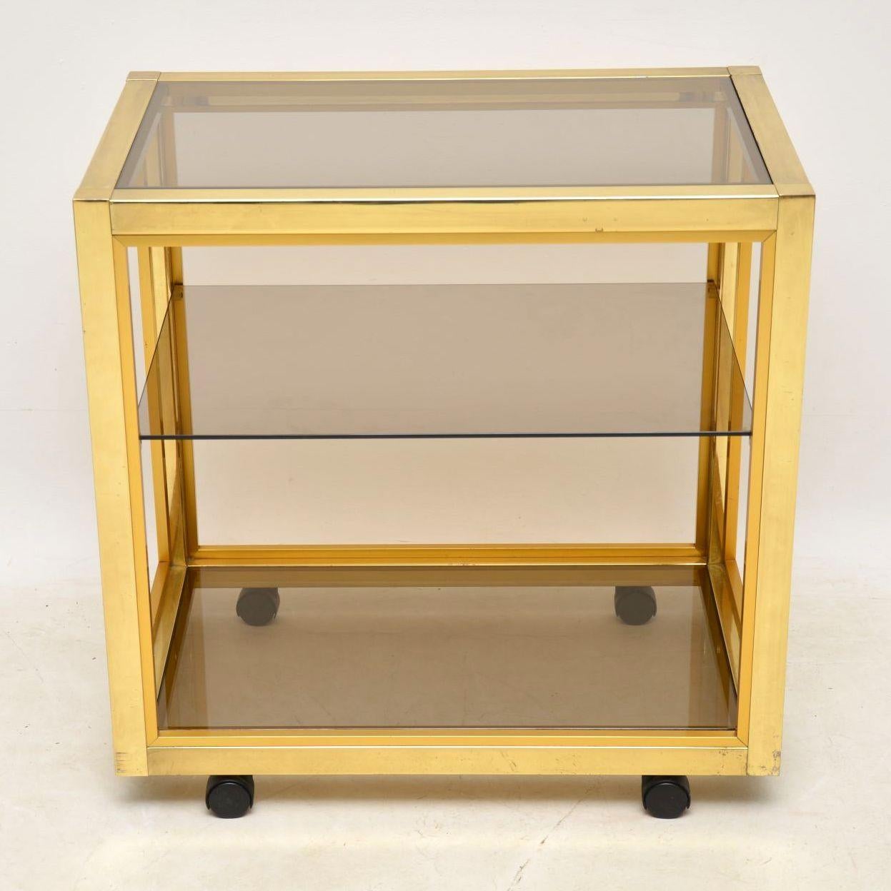 A beautiful and rare vintage Italian drinks trolley, this was made by Zevi in the 1970s. It’s made from brass plated aluminium, with removable glass shelves. The condition is excellent for its age, with only some extremely minor wear here and there.