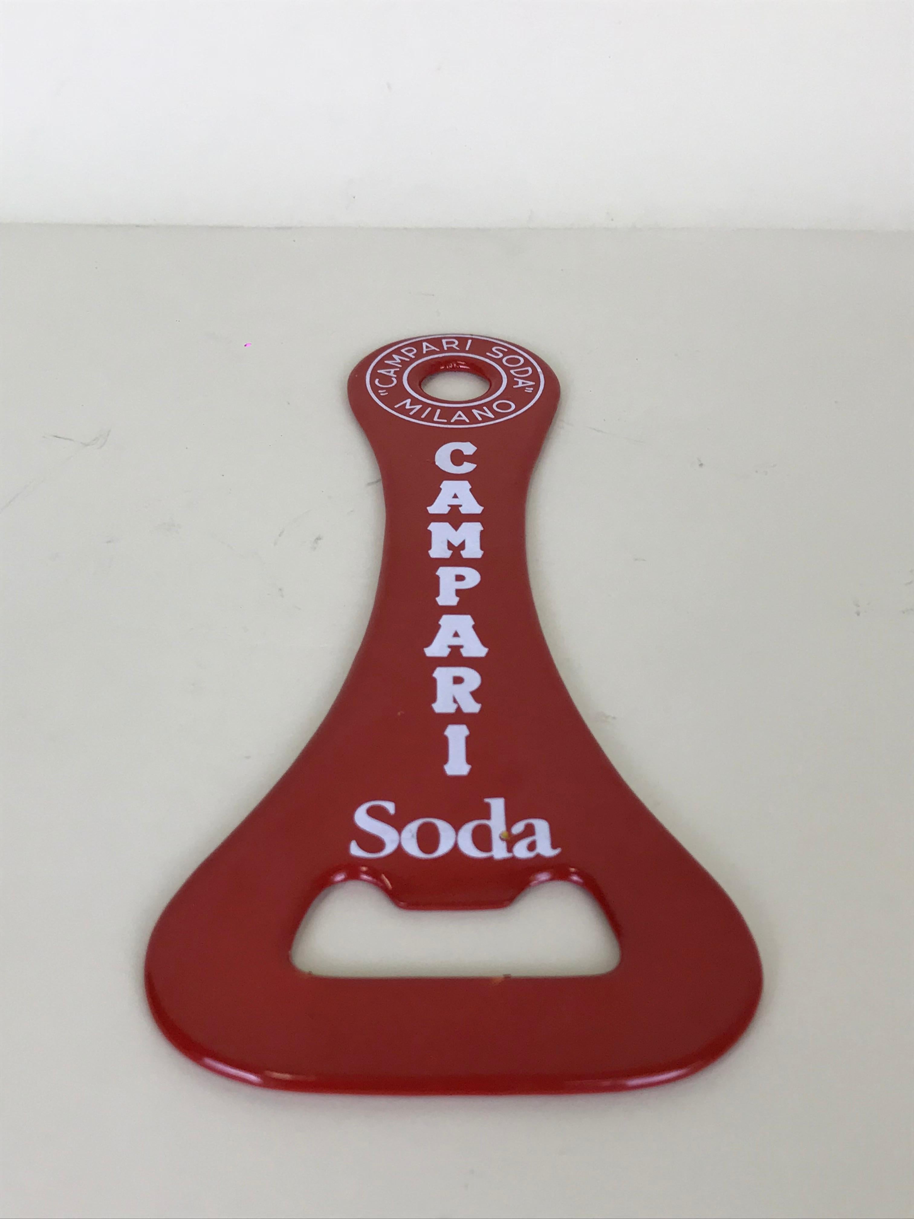 Iconic vintage Italian Campari Soda ultra slim metal red bottle opener.
 
Collector's note:

Campari is an Italian alcoholic liqueur, considered an apéritif obtained from the infusion of herbs and fruit in alcohol and water. Campari is an