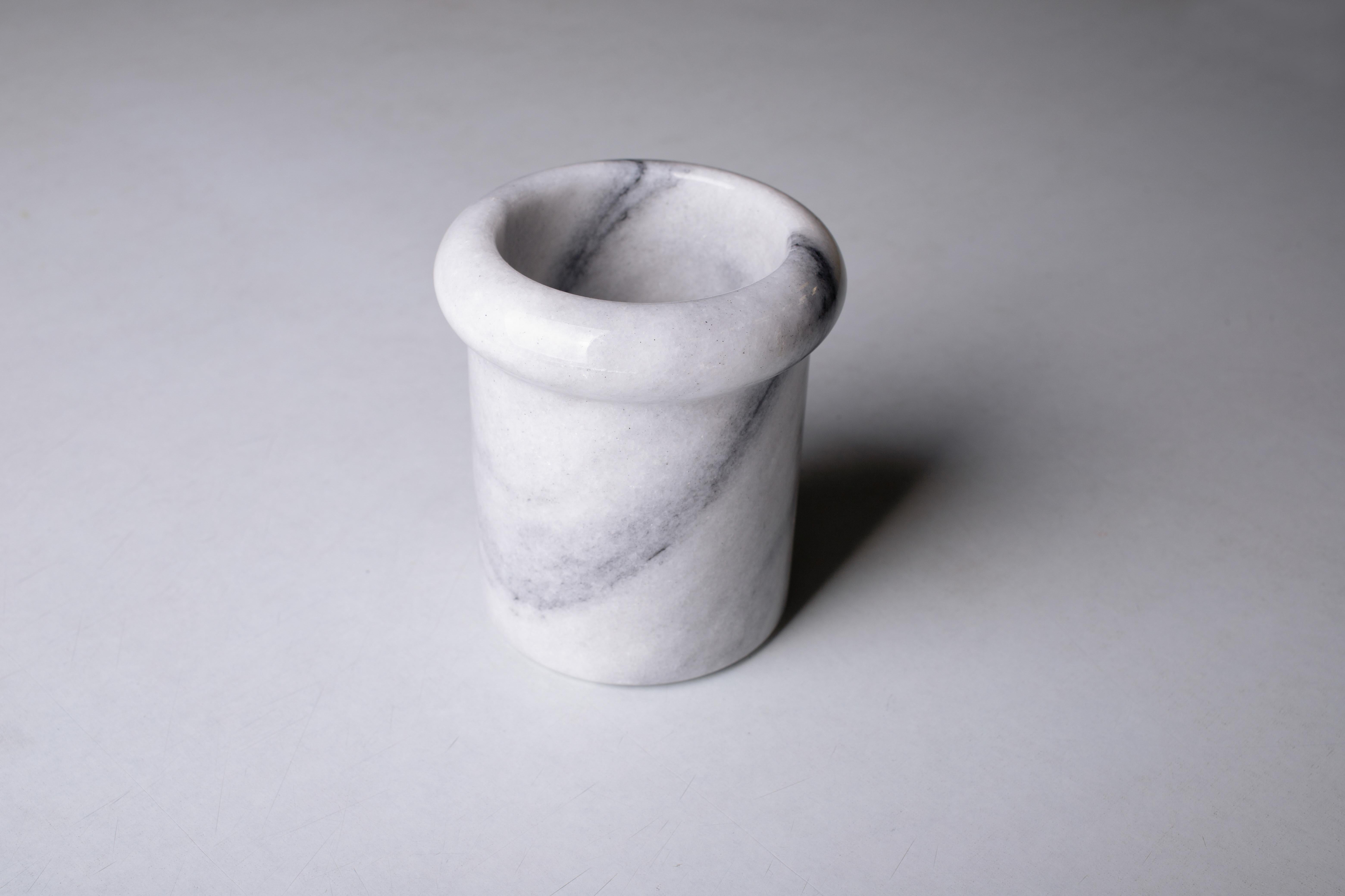 Adorable vintage carrara marble vase from the 1970s, Italy. Vertically oriented cylindrical form with a pencil round overhanging lip at the top opening.