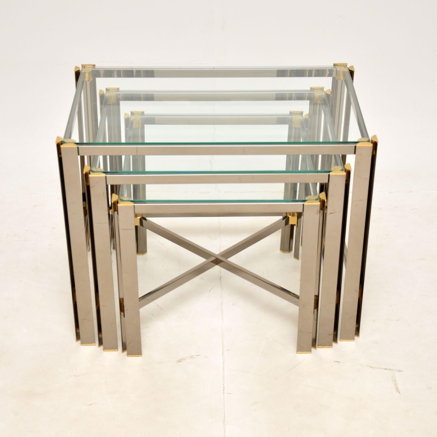 A very stylish and extremely well made vintage nest of tables in chrome and brass. They were made in Italy, and date from around the 1970s.

The quality is superb, they are beautifully made from chromed steel, with solid brass accents. They have