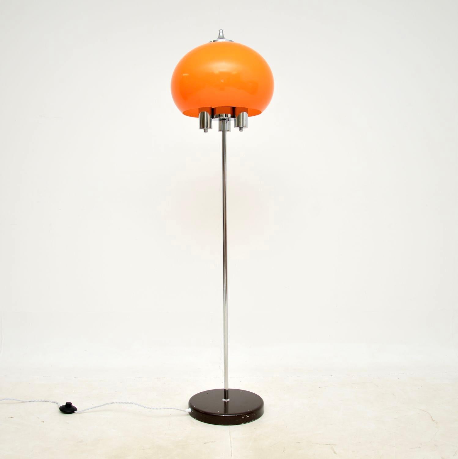 A stylish and very well made 1970’s vintage Italian chrome floor lamp.

The chrome frame is of amazing quality, with three bulb holders. There is a fantastic orange acrylic shade which is beautifully rounded, and compliments the chrome very