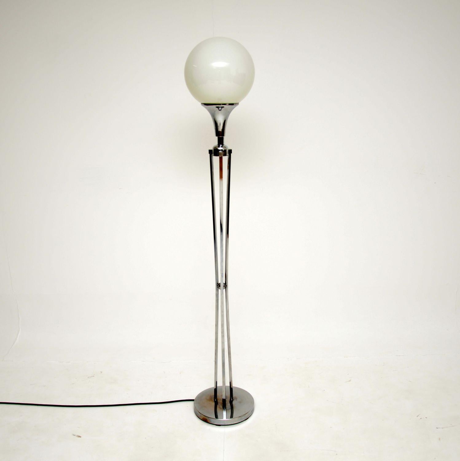 A very stylish vintage floor lamp with a chromed steel stand and white glass spherical shade. This was made in Italy, it dates from around the 1970’s.

This is of great quality and is a lovely size. It gives off a beautiful light, the glass shade is