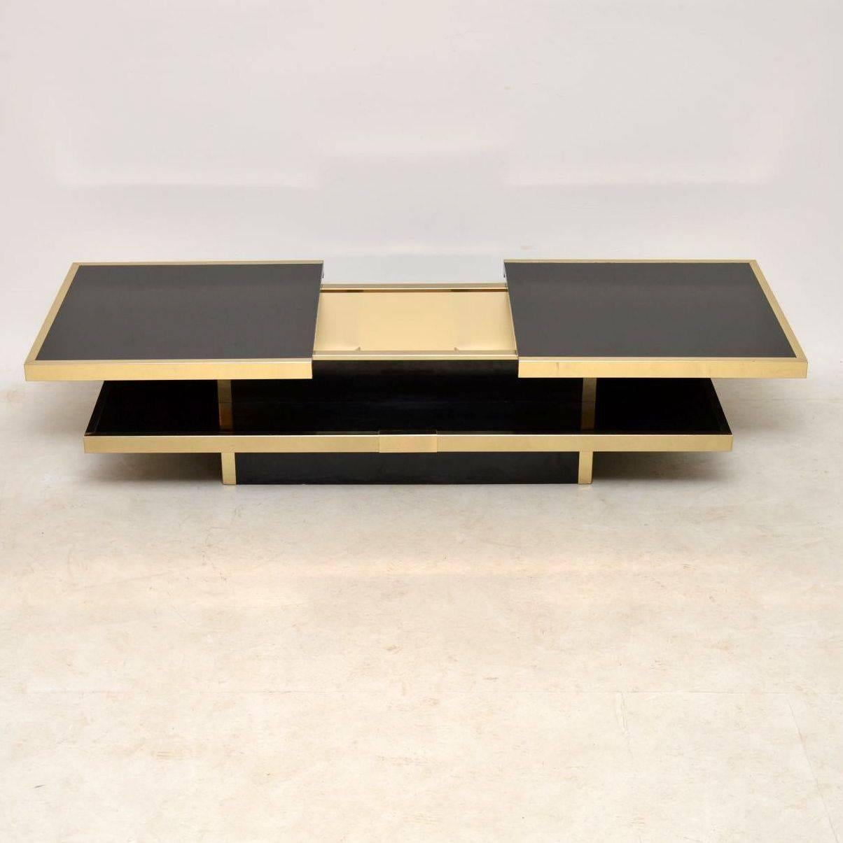 A magnificent vintage coffee table, this was made in Italy and dates from the 1970s. It’s very well made in black formica with a brass trim, and in great condition for its age. There is just some extremely minor surface wear here and there, the