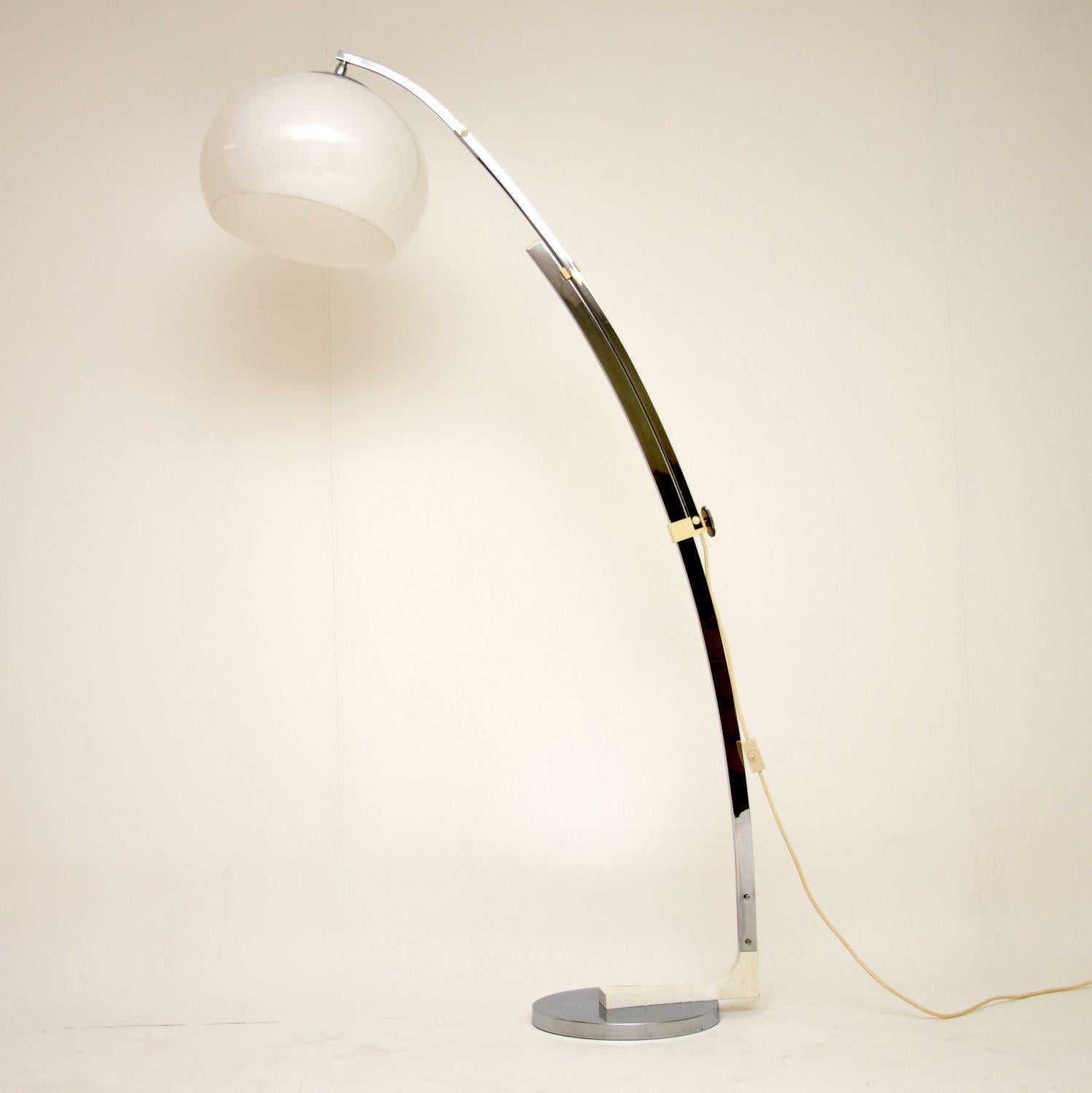 An amazingly beautiful vintage arc lamp, this was made in Italy and dates from the 1970s. It can be extended and lowered as seen in the images, the plastic shade can also be tilted and rotated. This is in superb condition for its age with barely any
