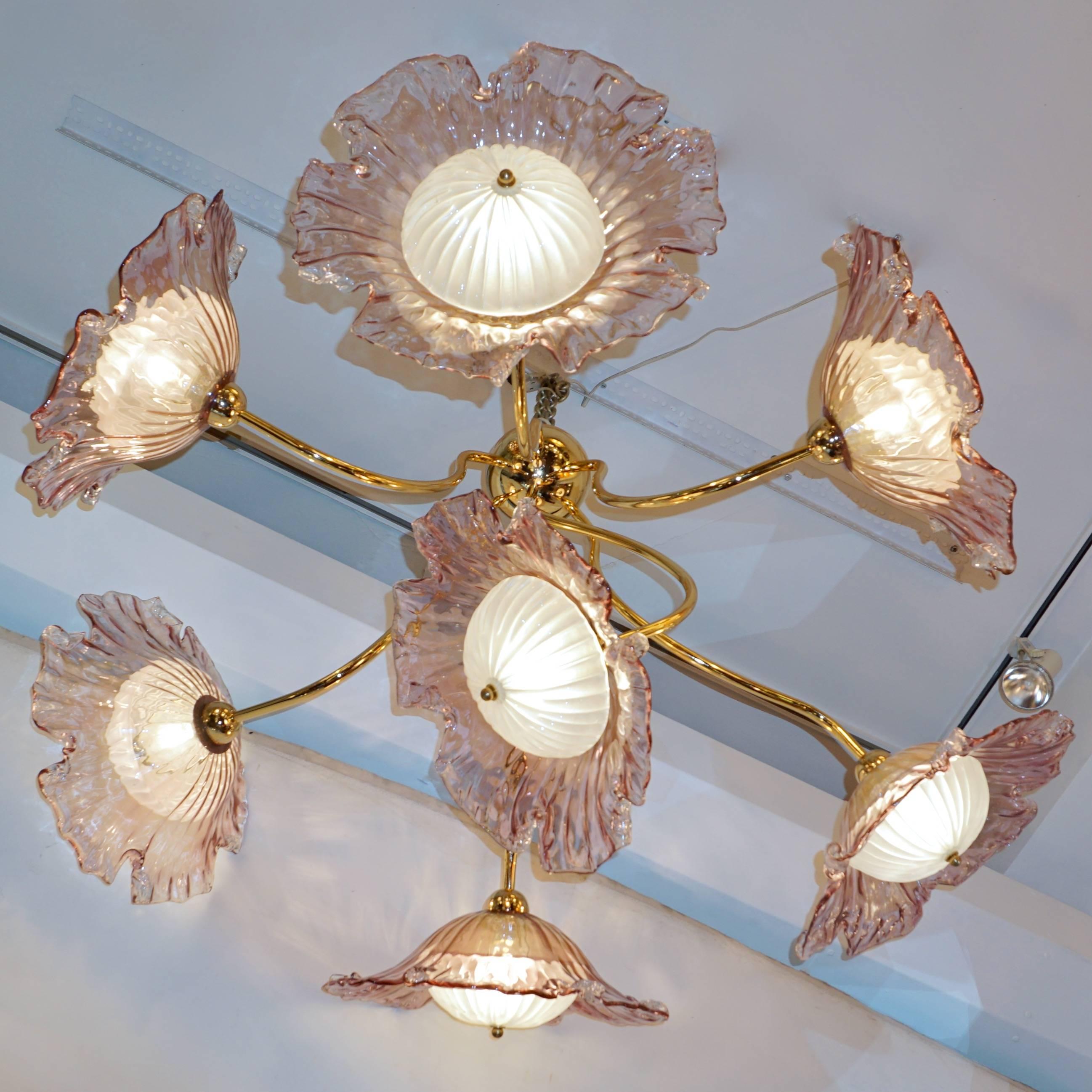 A one of a kind unusual Italian Fine design seven-light chandelier, entirely handmade in Italy on a handcrafted brass structure, a unique sculpture creation of a lavender pink Murano glass flower composition flowing out of a canopy that can be flush
