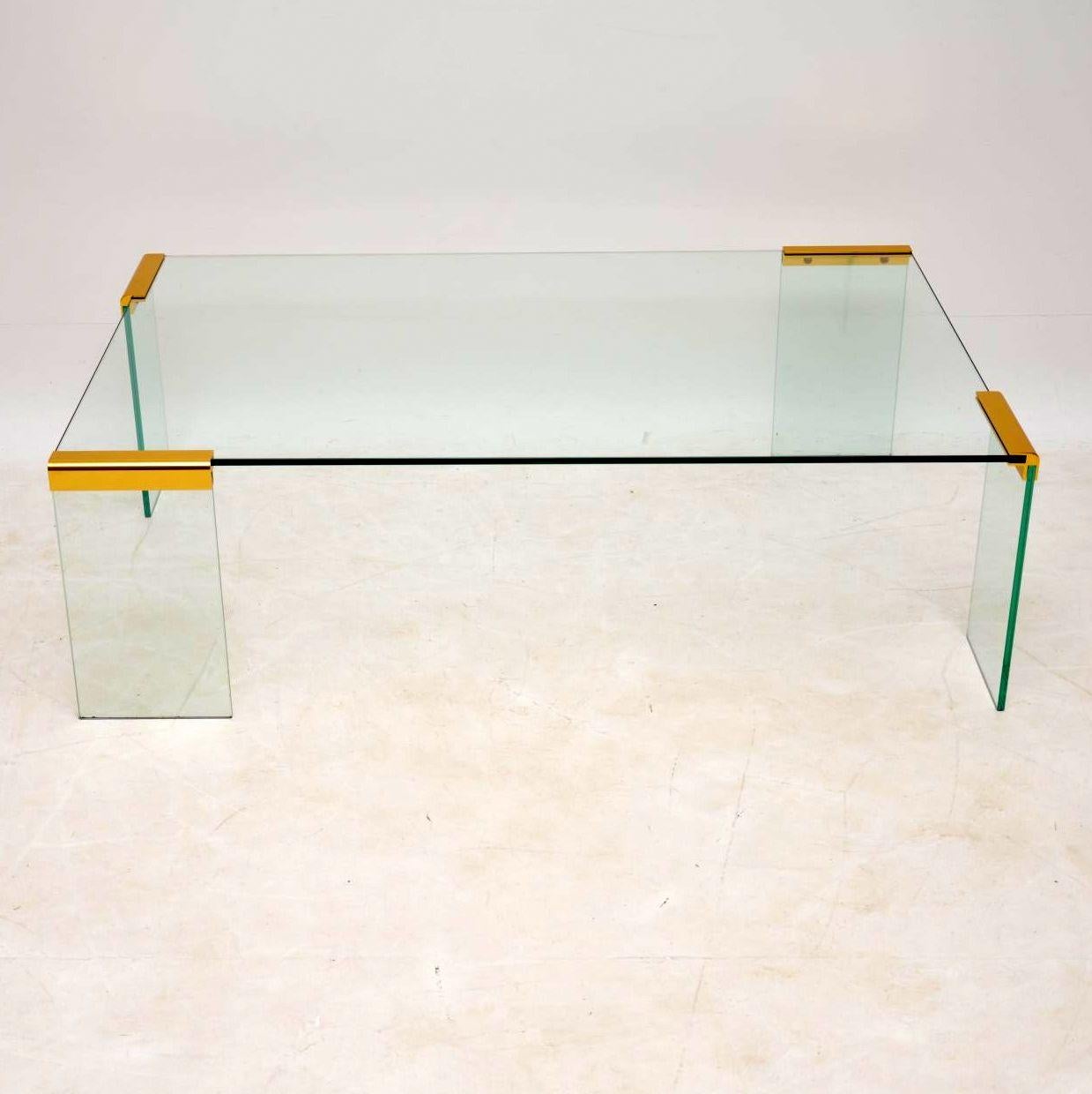 An absolutely stunning vintage coffee table from the 1970s, this was made in Italy by Gallotti & Radice. It’s of superb quality, it’s mostly made from clear toughened glass, held together by beautifully made brass fixtures. The condition is superb