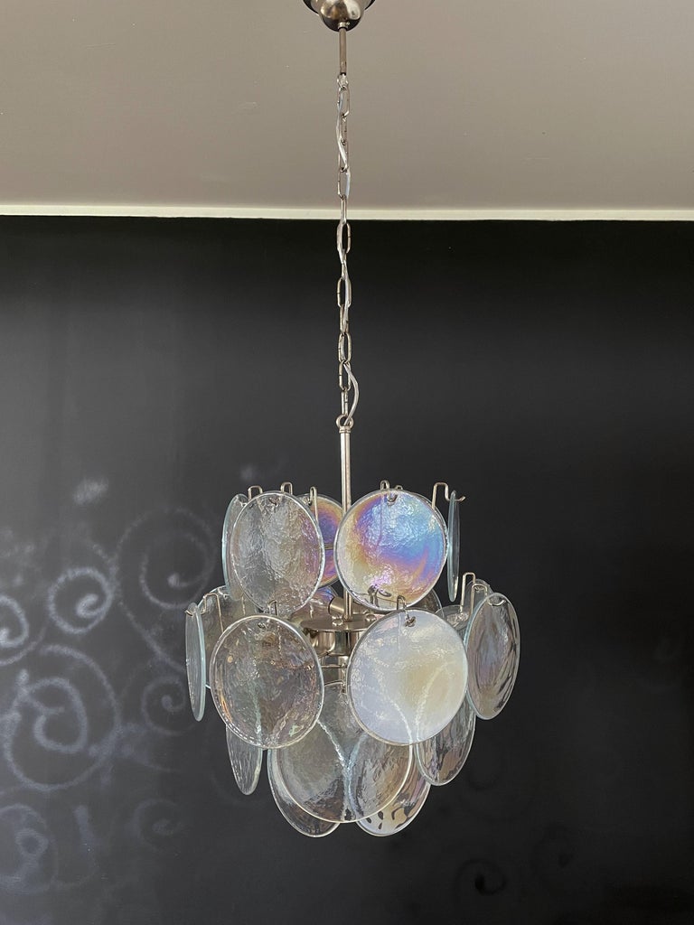 1970s Vintage Italian Murano Chandelier - 24 Pink Disks Vintage Italian Murano chandelier in Vistosi style. The chandelier has 24 fantastic iridescent discs in a nickel metal frame. The glasses have the particularity of reflecting a multiplicity of