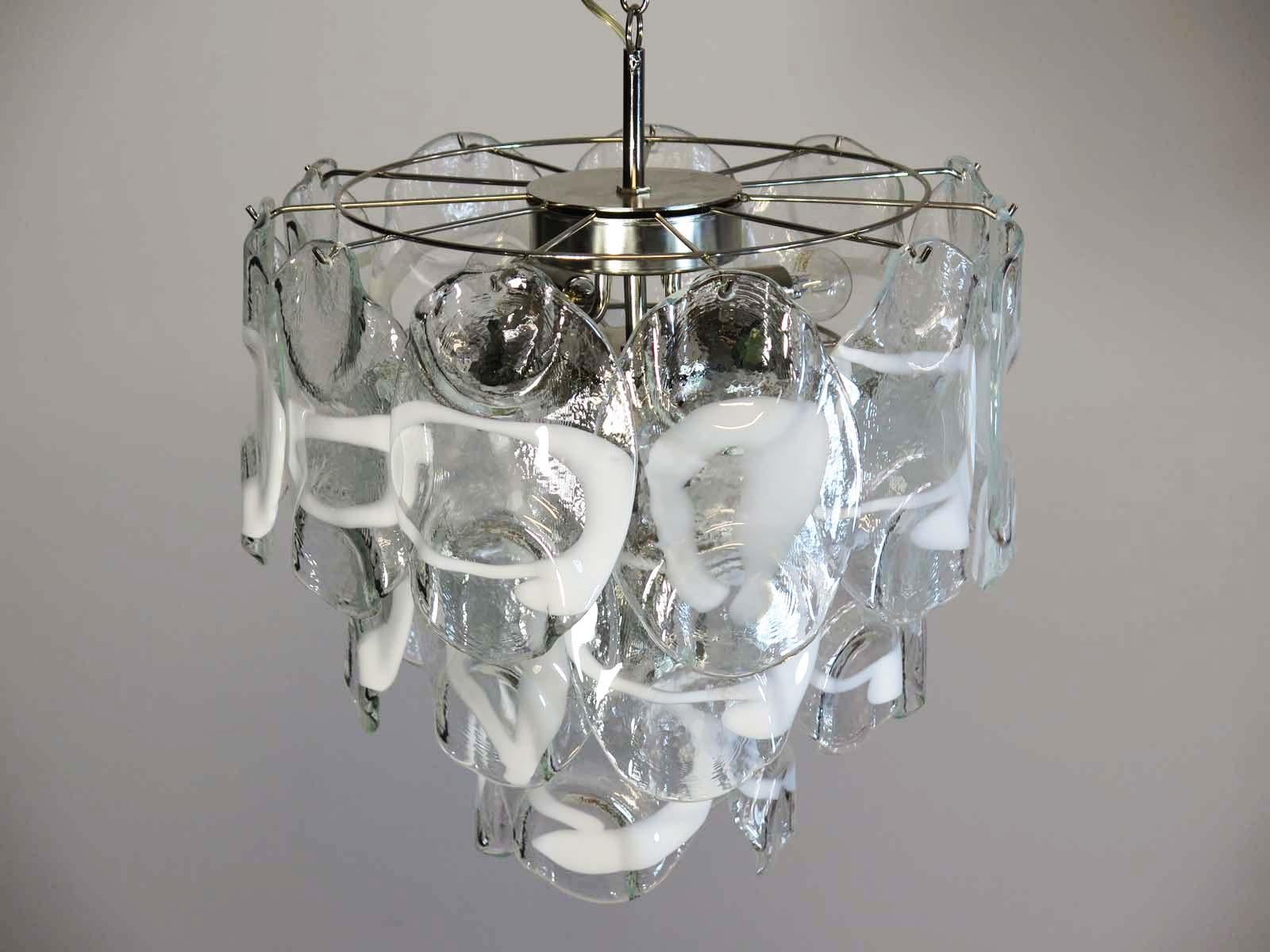 Vintage Italian Murano chandelier in Vistosi style. The chandelier has 23 fantastic Murano white and transparent glasses (
