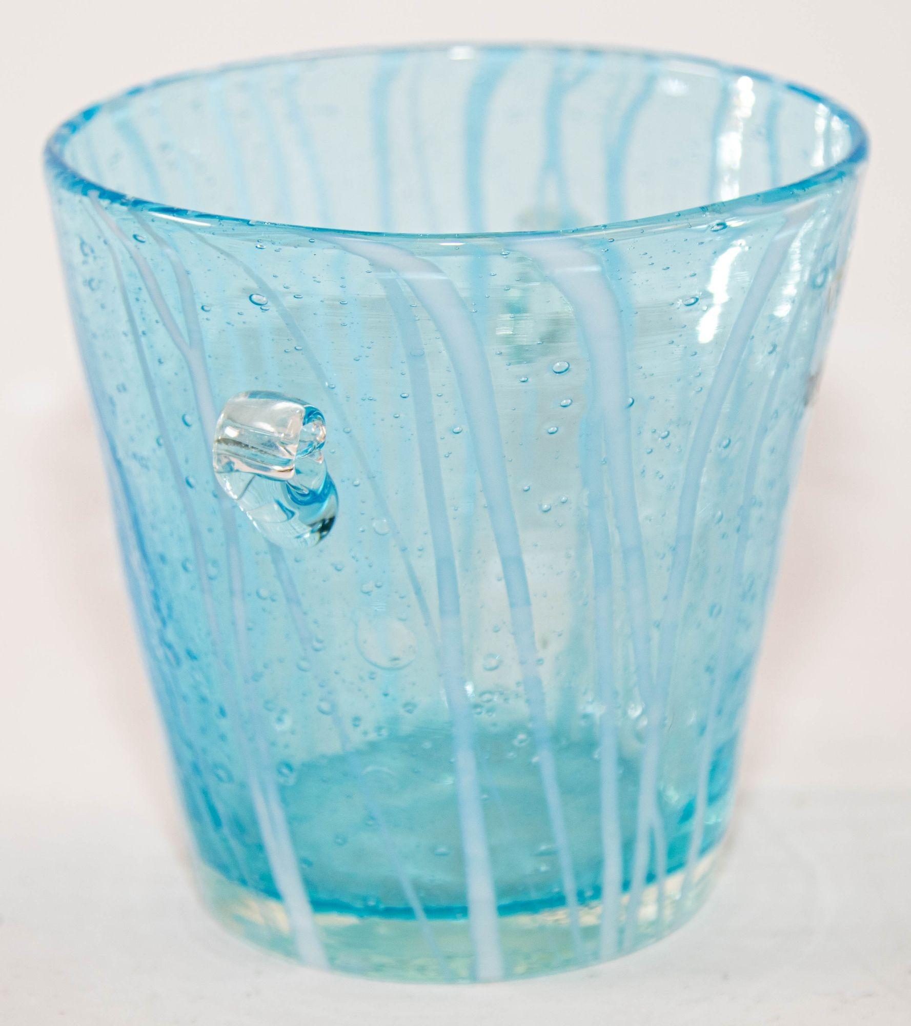 1970s Vintage Venini Murano Light Blue White Clear Wine Cooler Ice Bucket Made in Italy.
handcrafted Italian Murano Venini venetian art glass ice bucket .
This is a delicate blown Murano art glass ice bucket.
It has a flared shape from the base to